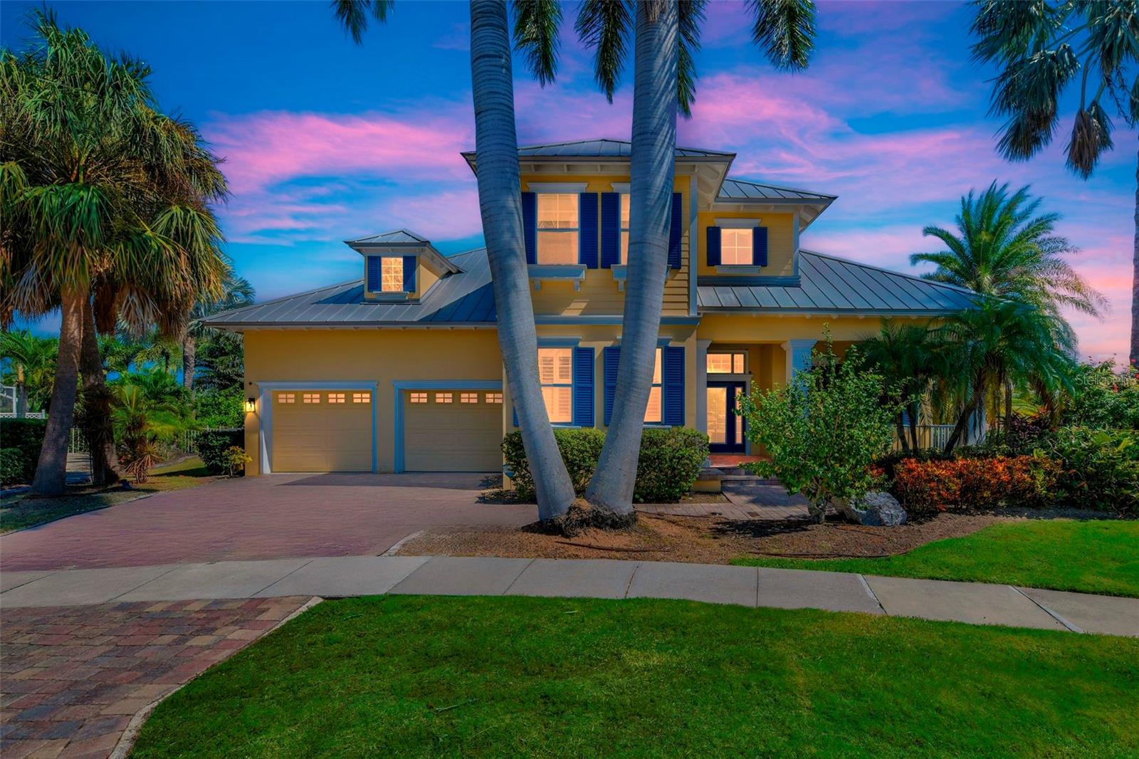 Welcome to your waterfront masterpiece in MiraBay! This custom 4-bedroom, 4-bath home sits on nearly half an acre, with 200 feet of saltwater canal frontage, a newly improved seawall, deeded dock, & boat lift — perfect for boating enthusiasts with unobstructed access to Tampa Bay. Step inside to over 3,900 sq ft of thoughtfully designed living space with an open floor plan. Highlights include a formal dining room, den/office, large family room, loft/bonus room, and a gourmet kitchen with granite counters, high-end built-ins, pot filler over the range, and stainless appliances. The primary bedroom is conveniently on the main floor. Elegant touches like real wood and distressed tile flooring, crown molding, tray ceilings, French doors, built-in bookcases, and high ceilings throughout. Outdoors, a 43-ft screened lanai with travertine flooring, summer kitchen, and serene views of the pool, spa, and canal make this home entertainer’s dream. Relax in the heated gunite pool & spa, enjoy the covered patio or upstairs balcony. The property is southwest-facing, offering beautiful natural light and spectacular golden sunsets. Situated in the award-winning MiraBay community, you’ll enjoy exclusive amenities like a resort-style pool, lagoon marina, fitness center, cafe, tennis & pickleball courts, playgrounds, and more. Located just 30-45 minutes to both Tampa/St. Petersburg and Sarasota/Bradenton — a rare blend of luxury, lifestyle & location.