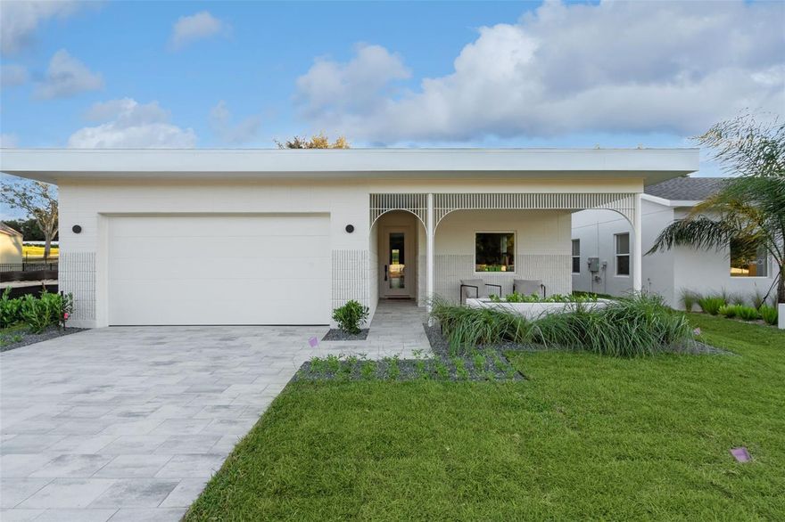 Completed Model home, move in ready, loaded with upgrades! This captivating single-story Cypress home presents a fresh, modern aesthetic and an effortlessly livable open layout. Its clean architectural lines and welcoming presence are immediately evident from the curb, featuring a striking contemporary facade with a two-car garage and a beautifully detailed covered entryway. Step inside to an interior bathed in natural light, where the smart, flowing layout connects the open-concept living, dining, and kitchen areas. The living room is an inviting space with sleek, light-colored flooring, a modern linear fireplace flanked by built-in shelving, and a massive sliding glass door that seamlessly extends the living space to the outdoors. The gourmet kitchen boasts light, flat-panel cabinetry, a generous island with seating, stainless steel appliances, and is perfectly positioned to serve the adjacent dining area. Just beyond the main living spaces, a private central courtyard offers a beautiful outdoor retreat, tiled and enclosed by the home's structure. The luxurious primary bathroom features a double vanity with ample storage, contemporary black fixtures, and a spacious glass-enclosed shower with stylish tiling. The secondary bathroom maintains the home's modern, sophisticated design with a double vanity and sleek black fixtures. Outside, the home is part of a dynamic new community. Boulevard Oaks is designed for connection and activity, centered around The Oasis clubhouse with inviting lounge areas and a resort-style swimming pool. Expansive greenspaces, walking trails, and pickleball courts offer residents numerous options for an active outdoor lifestyle, all nestled behind a welcoming, oak tree-lined boulevard.