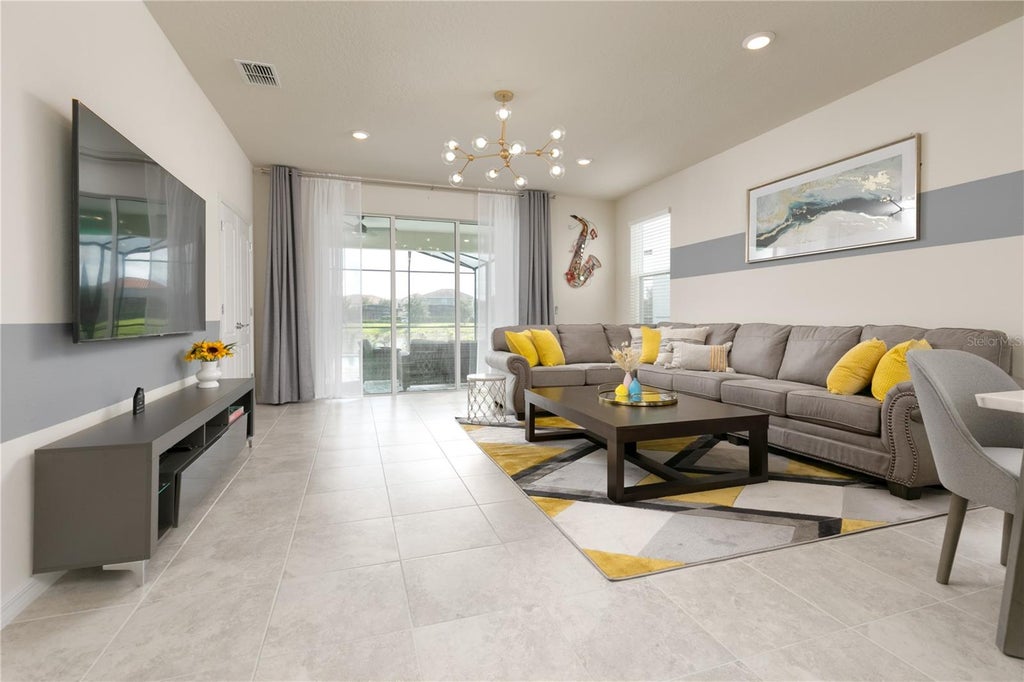 Photo of 7227 Oakmoss Loop, Davenport, FL 33837 (MLS # O6445081)