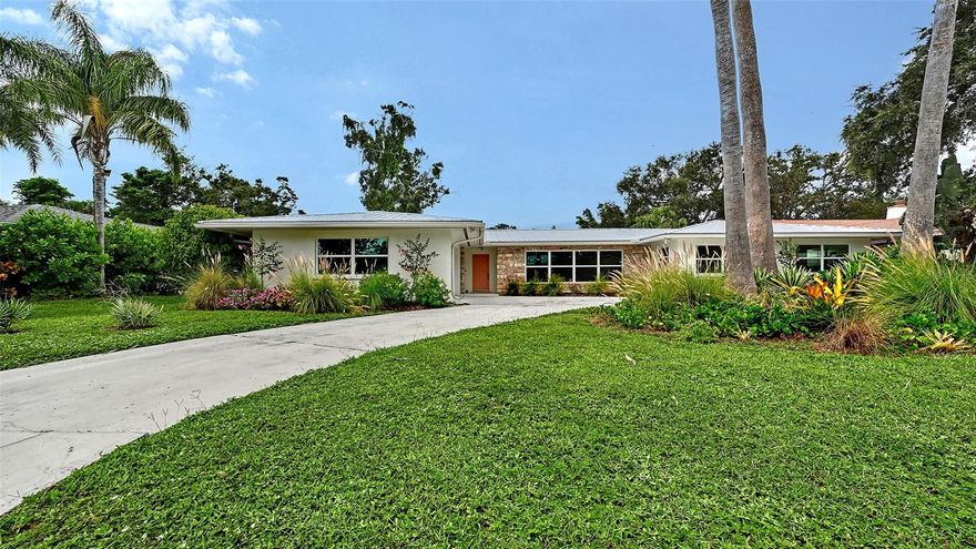 This beautifully reimagined Mid-Century Modern residence is set on an expansive 15,000-square-foot lot in Sarasota’s coveted South Gate neighborhood. It perfectly blends timeless architecture with contemporary design.  Every detail has been thoughtfully considered in this comprehensive renovation, creating a home that feels both refined and effortlessly livable. The open layout features four bedrooms and three full baths, high-impact windows, and a brand-new kitchen appointed with premium finishes, sleek cabinetry, and modern fixtures. Each bathroom showcases elegant tilework and designer details, elevating daily living.  The original terrazzo floors, carefully restored to their former glory, lend a sense of character and authenticity that anchors the home’s modern updates. A new metal roof and freshly painted exterior provide lasting peace of mind and enhance curb appeal.  Indoor and outdoor living blend seamlessly, with the main living areas opening to a new screened patio and sparkling saltwater pool accented by updated tile. The generous backyard, with access to Philippe Creek, offers endless potential—whether you imagine lush gardens, a firepit lounge, or an extended entertaining terrace.  Located minutes from Siesta Key’s world-renowned beaches, Southside Village, and Downtown Sarasota, this home offers the ideal balance of tranquility and convenience. Residents may also join the optional South Gate Community Association, featuring a private clubhouse, pool, and park areas.  Stylish, serene, and move-in ready, 2516 Tanglewood Drive captures the best of Sarasota living—Mid-Century character with a modern sensibility, set on one of the neighborhood’s most desirable lots.