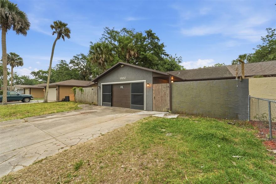 Welcome to 1302 Bond St., a single family attached home located on a quiet street with No HOA in Edgewater, FL. Suited for a first-time homebuyer or investor, this property offers a comfortable layout with an inviting open-concept living space and a cozy kitchen at the heart of the home.

The spacious primary suite features a beautifully remodeled bathroom with an upgraded shower and generous bedroom size. Enjoy seamless indoor-outdoor living with multiple access points to the backyard from the living room, primary bedroom, and garage—ideal for entertaining or relaxing.

Recent updates include updated flooring throughout, fresh interior and exterior paint, and a fully renovated primary bathroom. The home also features newer kitchen appliances, including a refrigerator less than a year old, a dishwasher still under warranty, and a newer garbage disposal. Major improvements include a newer A/C system (approximately 5 years old), replaced sliding glass doors, updated garage door opener and spring, and exterior enhancements with new plywood and lap siding at the rear of the home.

Step outside to enjoy the front patio deck—perfect for morning coffee or evening unwinding—and a spacious yard with updated landscaping. Added bonuses include security cameras installed on three sides of the home.

Located just off the main road, this home offers a peaceful setting with minimal traffic and a strong sense of community. Friendly neighbors and a welcoming atmosphere make this a place you’ll truly feel at home.