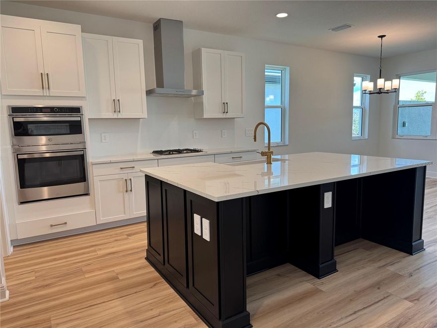 This brand-new move in ready Amelia model by M/I Homes is located in one of the premier gated communities just off Laurel Road near the New Hospital. Thoughtfully designed, 3 bedrooms plus a den, 2.5 bathrooms, an open-concept great room a Must See Gourmet Kitchen, and a 2-car garage. The heart of the home is the stunning kitchen, featuring a large quartz island, gas cooktop, built-in oven, and a spacious walk-in pantry, perfect for entertaining and everyday living. Luxury vinyl plank and tile flooring flow throughout, enhancing the modern design. The kitchen opens to a bright great room with access to a large covered lanai, complete with pre-plumbing for an outdoor kitchen. The private owner’s suite is tucked away and includes a spa-like en-suite bath and dual walk-in closets. Additional highlights include hurricane-impact windows, a tile roof, and a professionally landscaped yard, with maintenance included in the HOA. Residents enjoy resort-style amenities including a clubhouse with lounge and game room, fitness center, heated resort swimming pool, and 8 ft wide sidewalks ideal for evening walks. Conveniently located near Venice Beach, Downtown Venice, golf courses, the New Hospital and highly rated schools. ****SPECIAL FINANCING AVAILABLE FOR A LIMITED TIME ONLY FROM PREFERRED LENDER. RESTRICTIONS APPLY, FOR QUALIFIED BUYERS, SUBJECT TO APPLICABLE TERMS AND CONDITIONS. SUBJECT TO CHANGE WITHOUT NOTICE****