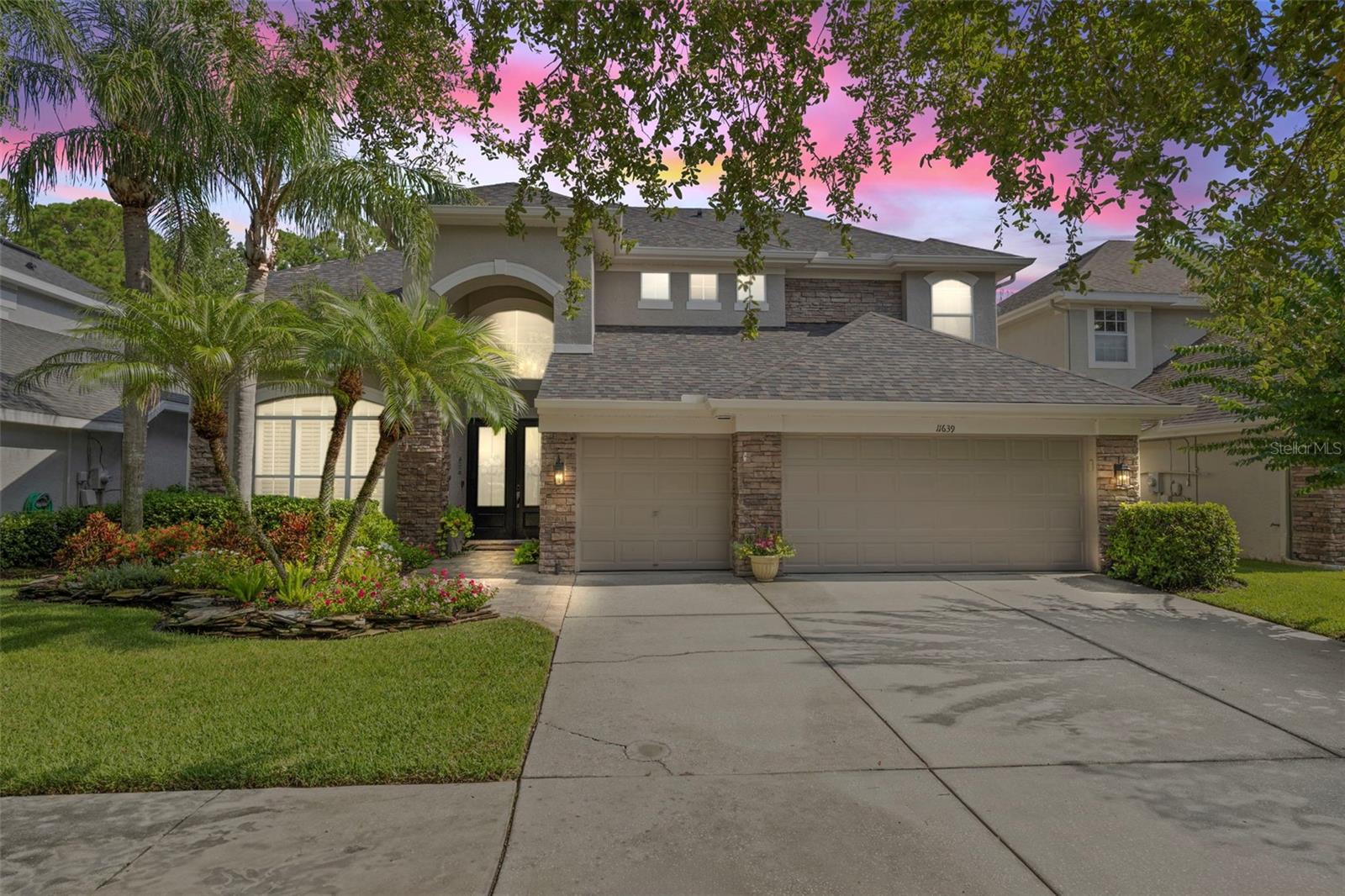 Welcome to this exquisitely remodeled home in the highly sought-after gated community of Mandolin Estates in Westchase. Built by Ryland Homes and nestled on a beautifully landscaped, conservation lot, this luxurious home offers over 3,600 square feet of thoughtfully designed living space, featuring 5 bedrooms (one currently used as an office), a spacious bonus room, and 4 full bathrooms. From everyday living to entertaining, the open layout and luxurious finishes make this home truly exceptional. The chef-inspired kitchen is a showstopper, featuring gourmet Thermador appliances, an induction cooktop with custom vent hood, Shaw farmhouse sink, leathered granite countertops and custom cabinetry with under-cabinet lighting. A newly added walk-in pantry with a soapstone countertop is the perfect place for a stylish coffee or juice bar, and provides generous storage, while a charming reading nook with a window seat and built in bookshelves offers a quiet space to unwind. Enhancing the home’s entertainment appeal is a custom bar complete with a full size Subzero wine fridge, water tap and glass cabinetry. The light-filled family room boasts soaring ceilings, large windows and sliding glass doors that open to the lanai while the formal dining room is ideally positioned near the kitchen for effortless hosting. The first-floor primary suite features private lanai access and a fully remodeled en-suite bath with custom vanities, a walk-in shower, and a freestanding clawfoot tub. A second bedroom and full bathroom are located on the main level – ideal for guests or multigenerational living, currently being used as an office. Upstairs are two additional bedrooms and a full bath, plus a fifth bedroom tucked beyond the bonus room with its own private bathroom—perfect as a teen retreat or in-law suite. Both levels offer dedicated storage rooms for added convenience. The outdoor living space is truly an entertainer’s dream, featuring an extended lanai with a stack-stone wood-burning fireplace, pavers, wood plank ceiling, and a fully equipped outdoor grilling area overlooking the sparkling pool. Additional highlights include wide plank hardwood flooring throughout, crown molding, plantation shutters, a new roof (2023), two new A/C units (2025), a new water heater (2023), fresh exterior paint and numerous additional upgrades detailed in the attached list. Located in the desirable 33626 Westchase zip code with top-rated schools, convenient airport access, and just 20 minutes to Florida’s beautiful beaches, this remarkable home represents the very best of luxury living in Tampa Bay. Homes rarely hit the market in Madolin and under contract quickly - so don't wait. Schedule your private showing today.