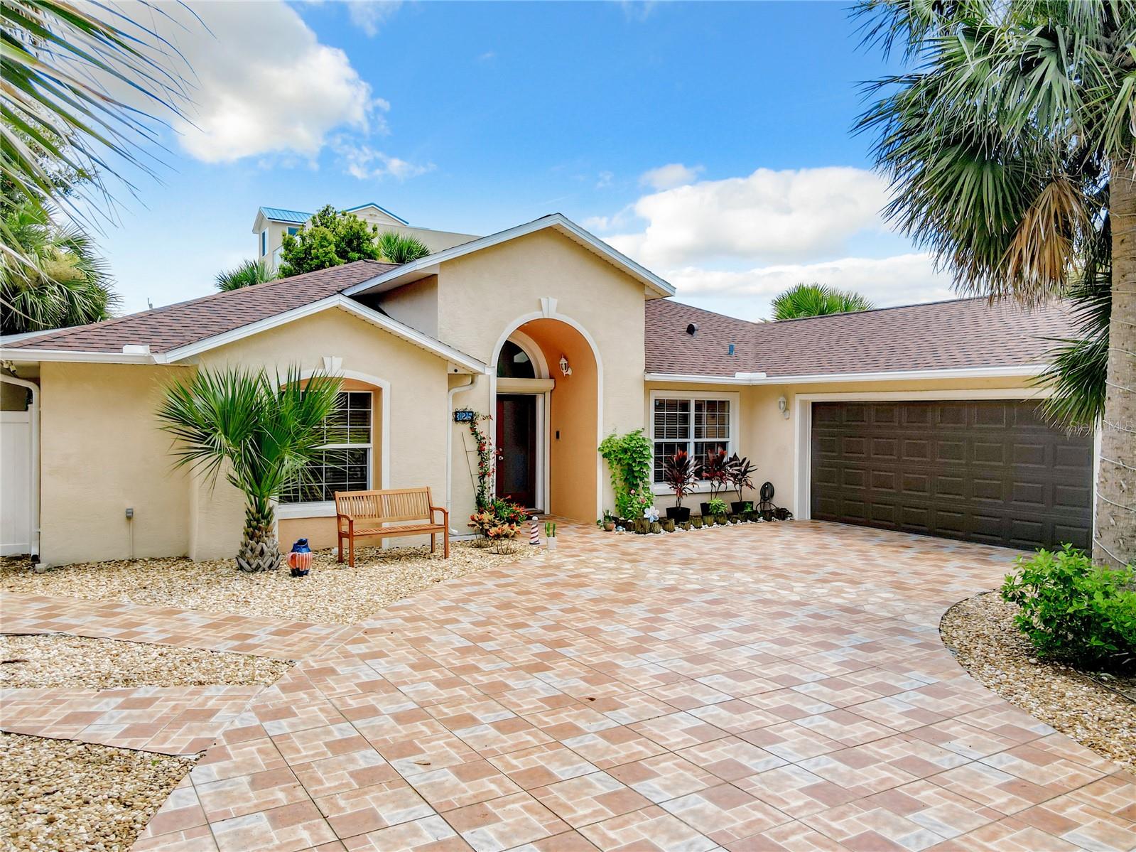 This is an amazing opportunity to own a Beachside home in the highly sought after, Flagler Beach, Priced to sell!! Located on a double lot, just 3 blocks from the ocean. 3 bedroom, 2 bath with over 2,300 sqft, expansive living space with its modern updated kitchen and skylights through out the home providing lots of natural light! The kitchen offers granite countertops, stainless steel appliances, wooden cabinets, and an island bar. New Porcelain tile flooring through out the home, with additional luxury laminate flooring in family room. Updated primary bedroom with an en suite bathroom including a garden tub, standalone shower, and a large custom-built walk-in closet. This home offers a bonus room, presently serving as an office. Warm and welcoming living room with many additional cozy spaces through the home. Many additional updated through out the home, must see! Impact, double- paned Windows. 2021 roof. The AC/handler and 50- gallon hot water tank installed 2023. A full house Predator 9000 generator conveys with the sale ensuring power at all times. Large driveway and oversized garage with non-skid paver tile. A storage shed with electricity can easily be used for golf cart storage as well. New 2023 perimeter fence surrounding the entire premises. Motion detector security lighting surrounds the home and garage. Ample space for boat or RV parking.