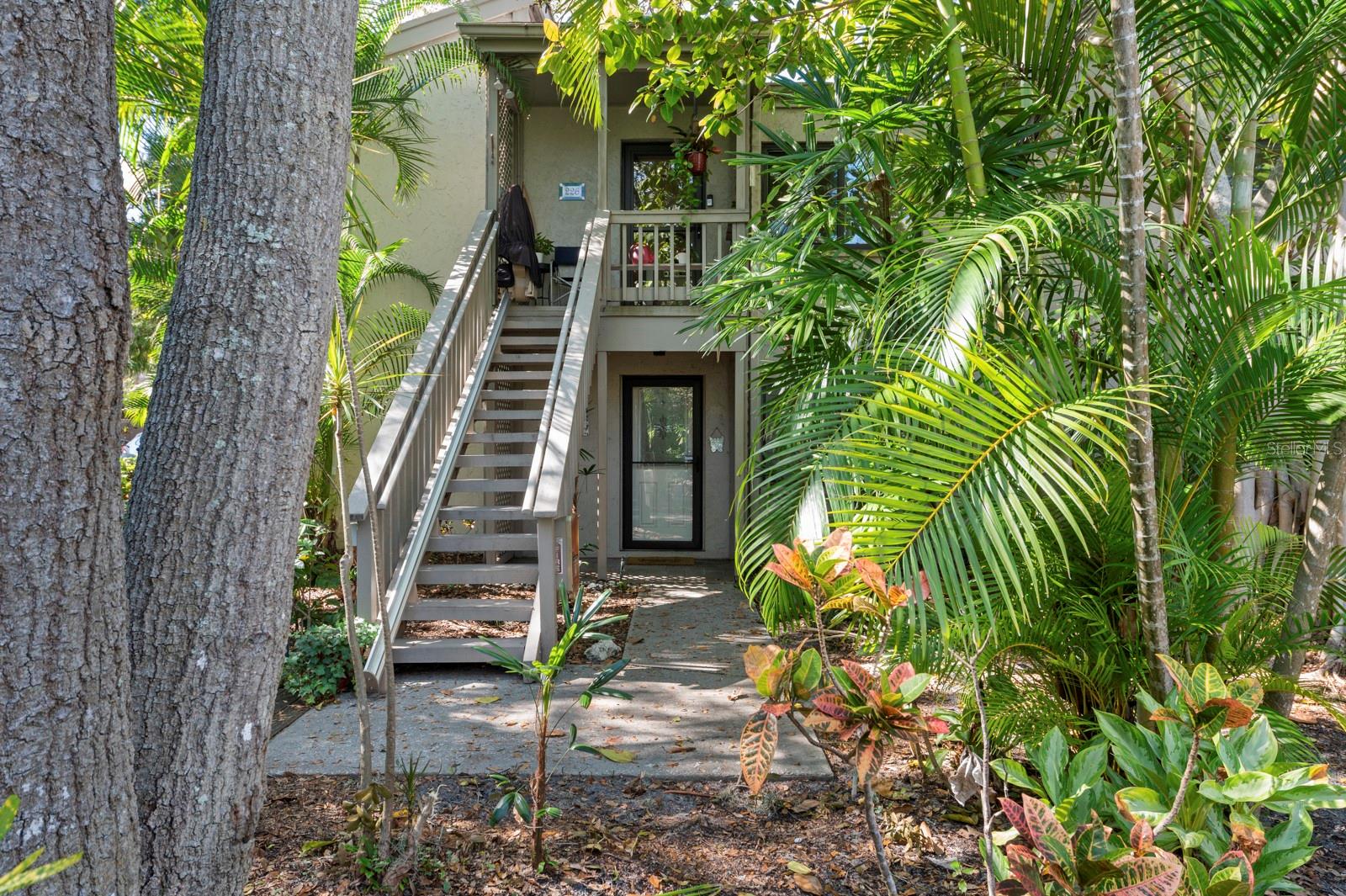 Experience the epitome of coastal living in the Pelican Cove, where this breathtakingly updated condo offers unparalleled harbor views. Revel in the natural light that pours in through the side/end windows and expansive sliding glass doors, illuminating the craftsmanship within. The kitchen boasts granite countertops, a timeless backsplash and crisp white cabinets, complemented by top-of-the-line stainless steel appliances. Modern conveniences abound, including a newer A/C system, recessed lighting, upgraded electric service, and etched-glass front door, and refreshed bathrooms with stylish granite vanities and enclosed shower in master bath. Unwind on your glass-enclosed lanai as you soak in panoramic harbor views while immersing yourself in nature's splendor. Spread across 75 acres of pristine, gated waterfront property, Pelican Cove is a tropical oasis teeming with amenities. Discover an 86-slip boat harbor, six heated swimming pools, a hot tub, three clubhouses, lighted tennis and pickleball courts, shuffleboard, basketball, dog walking areas, and over 5 miles of walking trails and boardwalks. Unleash your creativity with art studios, a pottery classroom, woodworking, and sculpting, or attend classes at Pelican Cove University. Choose from over 37 clubs, including photography, fiber art, biking, yoga, Tai Chi, culinary arts, and card clubs. The community also offers evening jazz and classical music concerts, ensuring an enriched lifestyle for all. Award-winning landscaping and superior management set Pelican Cove apart as the ultimate adult sanctuary. Just minutes from Siesta Key Beach, fine dining, and shopping, this stunning condo is your ticket to a life of luxury and leisure by the harbor/bay.