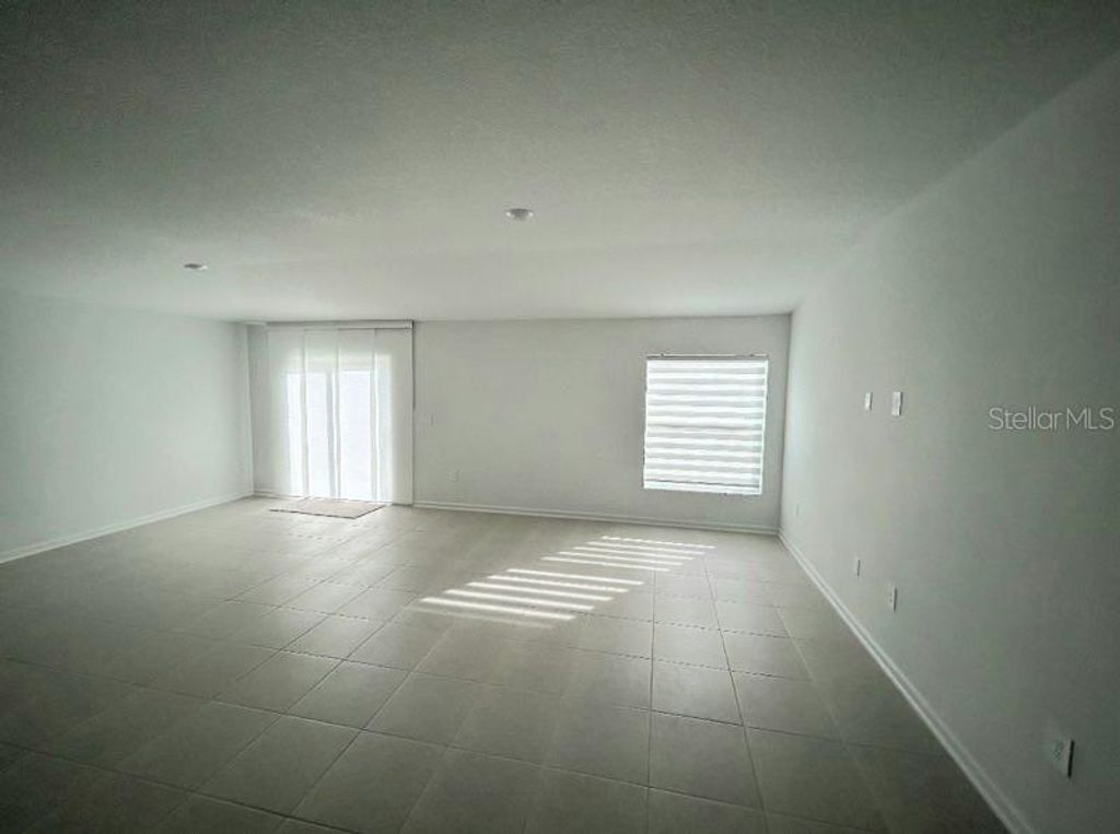 Photo of 5056 SW Barnet Dr #5056, Davenport, FL 33837 (MLS # O6369476)