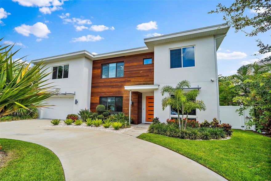 Welcome to 4207 W. Jetton Ave, a stunning contemporary home located in the Culbreath Heights neighborhood of Tampa, Florida. This exquisite property was built in 2020 and boasts a multitude of features that cater to modern living. With 5 bedrooms, 4 bathrooms, a media room, an office, a 2-car garage, and a pool in the backyard, this home offers both style and functionality. Situated on an oversized lot, the property provides ample space for outdoor activities and features stunning landscaping. As you step inside, you'll be greeted by a beautiful
sitting area to the left offering a cozy space for relaxation. Adjacent to this area, you'll find a dry bar and a pantry, granting easy access to the kitchen and ensuring convenience during gatherings and meal preparations. The open-concept lower level (which boasts hardwood floors) seamlessly combines the kitchen, dining room, and living room. The kitchen is a true highlight, featuring a spacious layout, Quartz countertops with a waterfall edge, and European-style flat panel wood cabinets wrapped with white acrylic. The large kitchen island serves as a focal point and is complemented by Bosche stainless steel appliances, an integrated refrigerator, floating oak shelves, and under-counter LED lighting. If that wasn't enough, the first level of the home also features a dedicated office, an inlaw suite with a full bath (which conveniently doubles as a pool bath), and hurricane impact sliding glass doors letting in plenty of natural light and creating an elegant and
airy ambiance leading to the backyard. Ascending the floating steel staircase, you'll discover the bedrooms on the second floor. High ceilings are a staple throughout the home. The luxurious main bedroom is sure to impress with a large panoramic window, two walk-in closets (with custom shelving), and direct access to the extraordinary en-suite bathroom. Here you'll find floating dual Quartz vanities, under-counter lighting, a frameless glass walk-in shower, and a solid vessel soaking tub. The designer wall and floor tiles further enhance the visual appeal
of the space. The rest of the second-floor features three additional bedrooms and two full bathrooms, along with a media room, perfect for having guests over for movie night. This residence is equipped with various modern amenities, including a tankless water heater, natural gas, a whole-home water filtration system, and a water softening system. Additional features include impact windows and doors, two 15 SEER HVAC systems, and 8' solid interior doors to ensure comfort and efficiency. The property also comes with a 2-car garage, a large laundry room, pre-wired security, and a remote video doorbell. The outdoor area is perfect for entertaining and relaxation, featuring a pool, a covered patio, and an outdoor kitchen. Whether you want to cool off in the pool or host a barbecue with friends, this backyard oasis offers endless possibilities. Location is key, and this home offers easy access to Downtown Tampa, Tampa International Airport, I-275, and the Westshore District, while also being situated in the Plant High School District. Don't miss the opportunity to make 4207 W. Jetton Ave your
dream home, where contemporary design, luxurious features, and convenient location seamlessly merge to create a truly exceptional living experience.