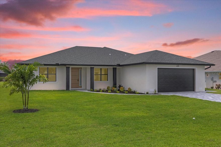 Live the waterfront dream in this brand-new luxury home in Pine Valley, Rotonda West, perfectly positioned along a peaceful canal with stunning water views and just minutes from the stunning Gulf beaches of South West Florida. Featuring 2,486sq ft of sleek modern design, this 4-bedroom, 3-bath home includes a versatile flex room (perfect as a home office or even 5th bedroom), a secondary primary suite and oversized 2-car garage. The showstopping kitchen boasts quartz countertops, a waterfall island, soft-close cabinetry, stainless steel appliances, and a designer backsplash; ideal for everyday living and entertaining. Soaring ceilings, impact-rated windows 8 foot tall doors throughout and an open-concept layout fill the home with natural light. The luxurious primary suite offers dual walk-in closets, a spa-inspired bath with floating vanities, an oversized shower, and a porcelain soaking tub. Enjoy Florida living at its finest with a spacious lanai and direct canal access for boating, bass fishing, or simply relaxing waterside. Thoughtful details, high-end finishes and waterfront living make this modern retreat a must-see! This could also be an amazing AirBnb rental opportunity.