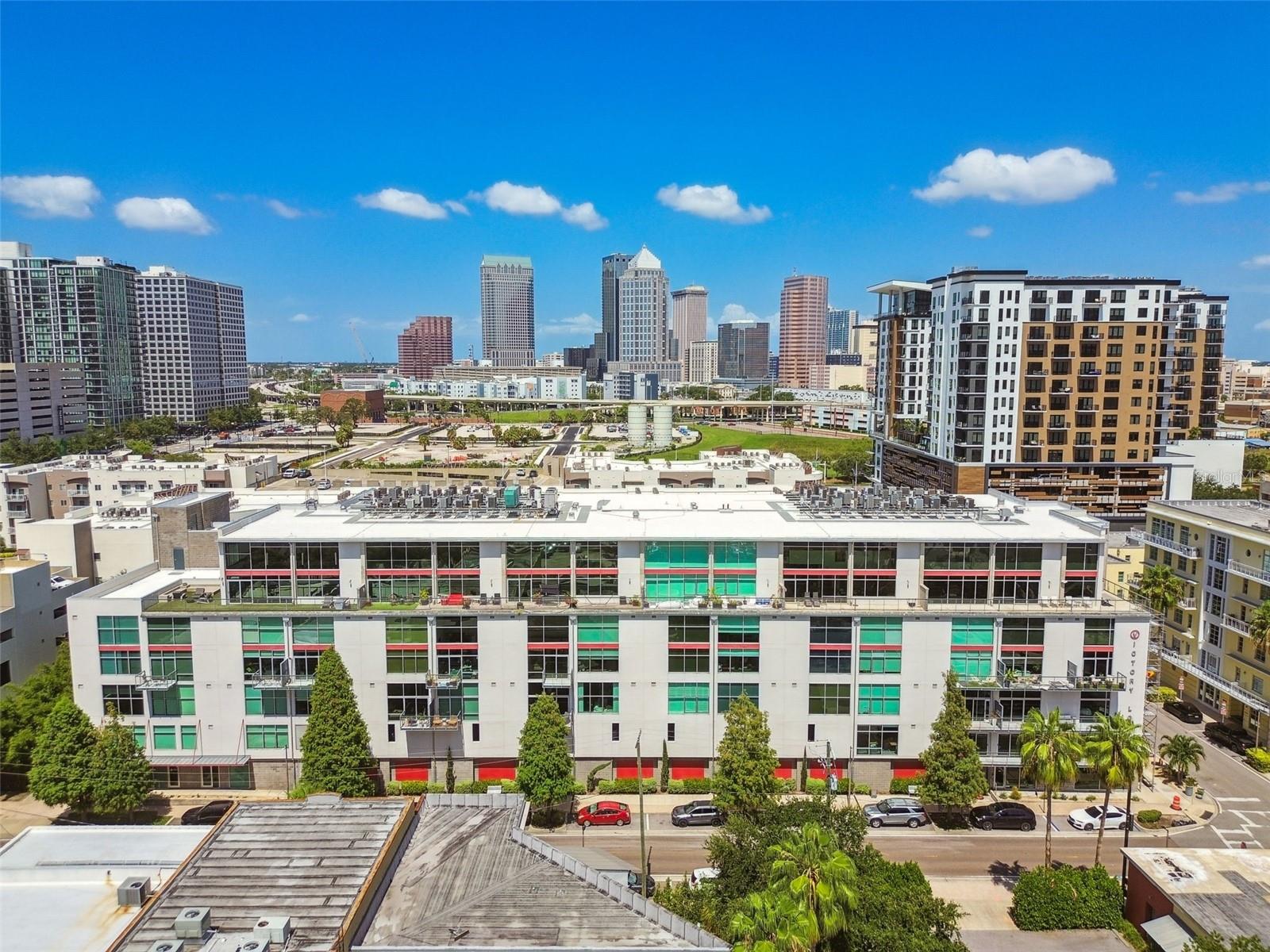 Feast your eyes on this 1 of 1 Luxury Corner Penthouse Unit in Victory Lofts located in the Downtown Tampa Neighborhood of Neighborhoods! The Channel District. This Penthouse offers ultimate privacy, fixtures, finishes and design elements that will gain your appreciation through each and every avenue. Two story corner unit with a breathtaking amount of windows and 22 ft tall ceilings overlooking the Port Of Tampa Cruise terminals and Sparkman Wharf. Fully Furnished with Restoration Hardware furniture, outfitted with Lutron Automatic smart shades, Sonos Speaker system throughout and personal cold plunge on your enormous oversized, fully turfed corner balcony ( over 900 sqft! ). This unit includes 2 assigned parking spaces ( as well as 2 street parking permits), just steps from the elevator which lead you directly to your front door, giving this unit even more of a private feel. Wake up in your primary bedroom every morning to the sunrise as your bedroom shades rise with the incredible view of Cruise Ships right in your backyard.
Walk, Scooter, E-Bike, Dash, Uber, or ride the trolley to all of the surrounding businesses and attractions. Some of the more popular options include Publix, Greenwise Publix, Duckweed Grocery, Crunch Gym, Gold's Gym, Starbucks, Gingerbeard Coffee, Victory Coffee, Riverwalk, Water Street, Sparkman Wharf, Edition Hotel and Amalie Arena.
This renovated condominium is a testament to luxurious living, offering an exquisite blend of comfort, style, and modern convenience. Come, experience this phenomenal property for yourself. Your new lifestyle awaits.