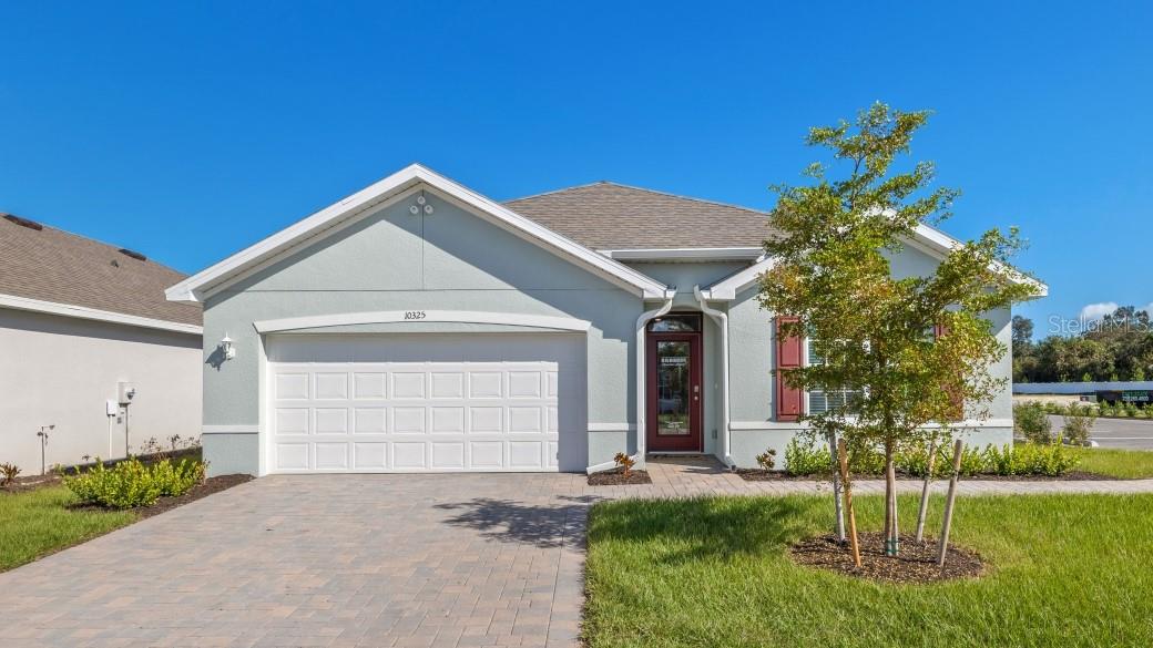 The appealing one-story home includes many contemporary features and an open-concept design. The well-appointed kitchen includes a large island perfect for bar-style eating or entertaining, a walk-in pantry, and plenty of cabinets and counter space. The dining room and living room both overlook the covered lanai, which is a great area for relaxing and dining al fresco. The large primary bedroom located at the back of the home for privacy, can comfortably fit a king-size bed, and includes an en suite bathroom with double vanity, big walk-in closet, and separate linen closet. Three other bedrooms share a second bathroom. The two-car garage connects to the front hallway where the laundry room and an extra storage closet are also located.