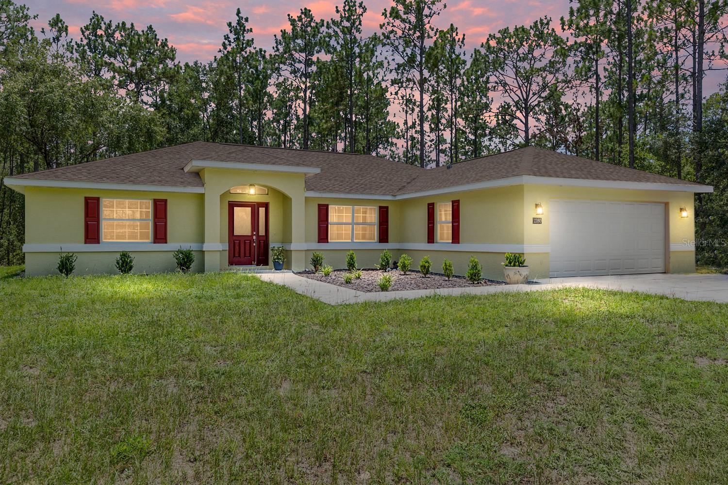 Discover this charming newer 3-bedroom, 2-bathroom, 2-car garage home, built in 2023, nestled on just over an acre in the serene community of Rolling Hills. This Triple Crown-designed home features ceramic tile in the main living areas and cozy carpet in the bedrooms.
Benefit from beautiful granite countertops and a spacious split floor plan that enhances both comfort and functionality. Surrounded by lush nature, this home offers a private retreat, ideal for outdoor exploration with your favorite toys, such as side-by-sides and quad runners. There's ample space for RV parking or the potential to build an external garage. Conveniently located, this home is just 15 minutes from grocery stores, shopping centers, hospitals, and other essential amenities. It's also about 30 minutes from Downtown Ocala and the Popular World Equestrian Center. It is also about an hour from Gainesville and approximately 2 hours from Orlando and Tampa airports and theme parks, as well as some of Florida’s most popular beaches. Don’t miss out on the opportunity to make this beautiful home your own!