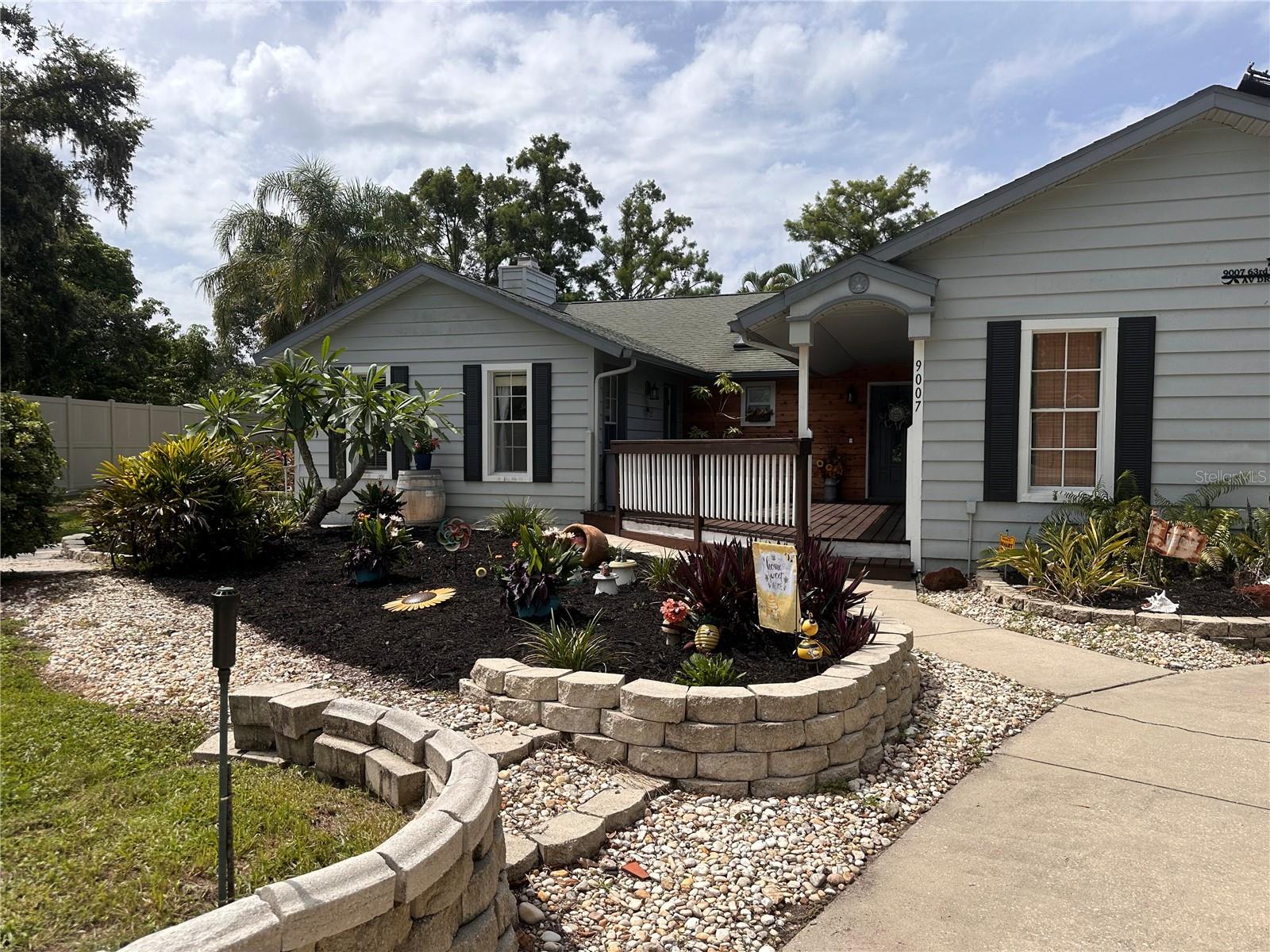 BEAUTIFUL POOL HOME WITH RV GARAGE and NEWLY RENOVATED BATHS. Welcome to this charming home offering nearly 2100 square feet of comfortable living space on a spacious 0.8-acre lot. Set within a peaceful, tree-lined neighborhood known for its oversized lots and unique homes, you won't want to miss this gem that sits on a serene lake and offers a finished enclosed RV garage. Inside, you'll find a bright and open living area featuring vaulted ceilings and a cozy fireplace, perfect for relaxing or entertaining guests. The kitchen is thoughtfully designed with ample cabinetry, a convenient pantry, and a sunny breakfast nook. The master suite serves as a private retreat with a walk-in closet and a well-appointed en-suite bathroom that includes dual sinks. Two additional bedrooms perfect for for guests, or an office space. Step outside to enjoy the Florida lifestyle on the screened lanai overlooking a large, beautifully landscaped backyard—ideal for outdoor dining, gardening, or simply unwinding in the shade. Braden Woods offers residents the perfect balance of tranquility and convenience, with easy access to shopping, dining, and major highways. Don’t miss your chance to own a home in one of Bradenton’s most coveted neighborhoods—schedule your private showing today!
