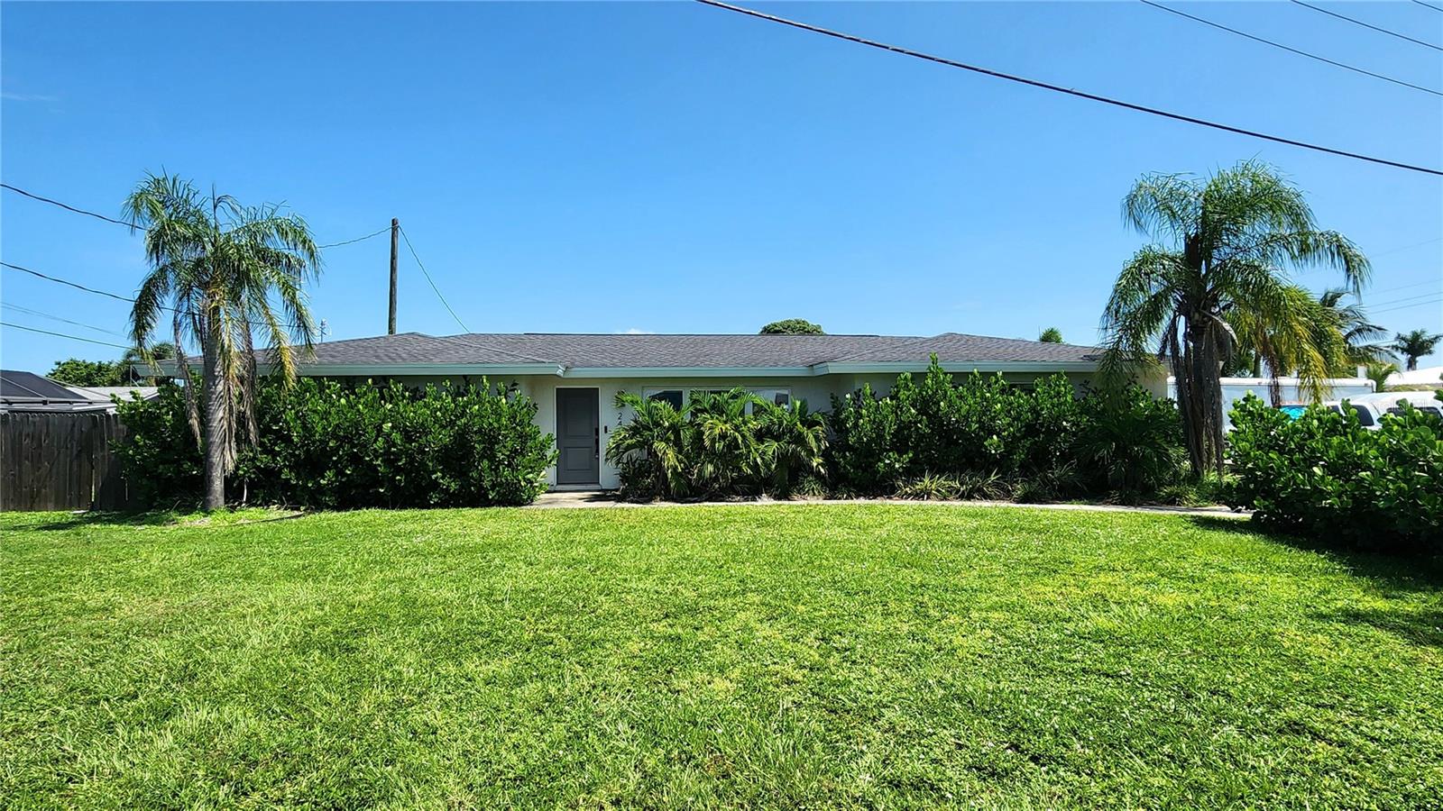 Now available in the heart of Sarasota—an exceptional pool home offering unbeatable value, location, and lifestyle! You simply won’t find another lease opportunity like this: a fully updated 3-bedroom, 2-bath home with a flex room, 2-car garage side entry, private pool with lawn & pool maintenance included, and no HOA—all for just $3,500/month! Situated on a corner lot in desirable Phillippi Gardens, this stylish home with over 1550 Square Feet features a bright, open floorplan with wood-look flooring throughout, recessed lighting, and designer finishes. The living room boasts beautiful front windows, an industrial fan, and seamless flow into the upgraded kitchen with quartz countertops, white cabinetry, stainless steel appliances, upgraded hardware, under-mount sink, flat-top range, microwave, and a pass-through window to the pool for easy entertaining. Enjoy added versatility with a flex room offering sliding glass doors to the screened pool deck—perfect for a home office, den, or guest space. The primary suite includes a huge walk-in closet, ensuite bathroom with dual vanities, an oversized tiled shower with seamless glass entry, and upgraded fixtures. Bedrooms 2 and 3 also feature built-in closets, ceiling fans, and wood floors. The full bathroom between the two bedrooms also has dual vanity, upgraded cabinet and hardward with tiled shower and decorative custom finishes. Outside, you’ll find a fully fenced backyard, large patio, outdoor shower, and a sparkling pool so you can JUMP into the Florida lifestyle!! With a floor plan like this, chef's kitchen and backyard OASIS this home is a dream and ready to entertain family and friends! Laundry is located in the garage (washer & dryer included), and 5-inch baseboards add a modern touch throughout. With a front driveway, side driveway, fully fenced back yard with gates there is plenty of parking and space! This is your chance to live in one of Sarasota’s most sought-after neighborhoods, just minutes to Siesta Key, shopping, dining, and top-rated schools. Homes like this don’t last—schedule your private showing today!