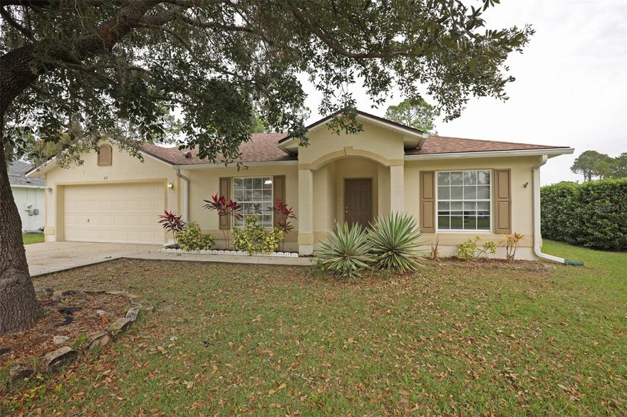 Fabulously maintained beauty with new roof in 2022 new HVAC and water heater in 2024. This is move in ready on a quiet street tucked away in the Pine Grove section of Palm Coast. A large, covered lanai in back offers enjoyable evening barbeques or morning coffee sipping.