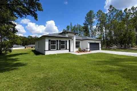 Photo of 13141 SW 83rd Terrace Road, Dunnellon, FL 34432 (MLS # O6434172)