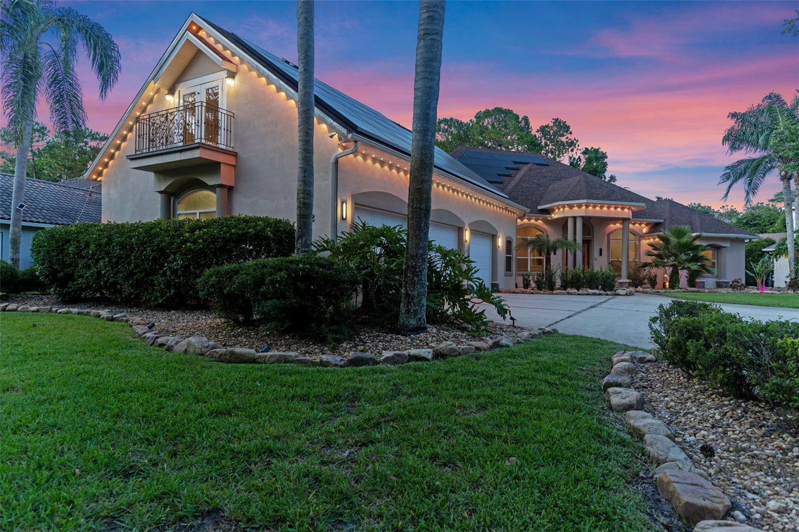 Introducing a private estate on over ¾ of an acre in the sought-after Hunters Ridge community. This elegant executive pool home spans 4,335 square feet of refined living space and is thoughtfully designed to embrace comfort, function and entertaining on every level! Crafted with integrity and elevated details, the home features five bedrooms, four full baths, a dedicated home office and an expansive bonus room with private balcony access, ideal for guests, a secondary en suite, multigenerational living or media room. The residence opens with a grand impression, 14-foot tray and coffered ceilings, rich hardwood floors and an open-concept flow that seamlessly connects the formal dining room, great room and kitchen. Go outside to your sanctuary, an enclosed lanai and sparkling pool with water features and a large backyard perfect for play and entertaining. The oversized three-car garage provides generous built-in storage, work benches and includes a dedicated EV charging station. Solar panel system (to be paid off at closing), offering energy efficiency and peace of mind. Residents of Hunters Ridge enjoy a rare blend of natural beauty and lifestyle amenities to include a community pool, tennis courts, playground, a clubhouse available for private events, sidewalk-lined streets and a beautifully maintained atmosphere. Just minutes from the Ormond Scenic Loop, beaches, and the Intracoastal Waterway, this home offers a serene setting with access to all the natural and cultural offerings of Ormond Beach. Just 15 minutes to downtown Ormond Beach with shops, dining, art galleries and cultural centers as well as proximity to Daytona, Flagler and major roadways.