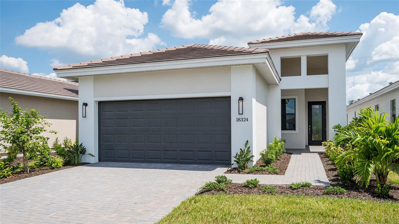**NEW CONSTRUCTION**Enjoy this home featuring 2 Bedrooms, 2 Bath, a Den with double doors and 2-Car Garage located close to a lake. The spacious layout includes wood-look tile flooring throughout the main living areas and Den. The Great Room boasts additional surface-mounted LED lighting, while the Kitchen opens to the Dining area, perfect for entertaining. The Owner's Bedroom offers a luxurious Bath with a frameless shower enclosure and pebble tile shower floor. Outdoor living is enhanced with a summer kitchen gas, plumbing and electric connection and a privacy wall on the lanai, overlooking a serene berm backyard with no homes across. This home also includes a 2-Car Garage and designer finishes throughout, making it the perfect retreat, and Taexx built-in pest control system. Cresswind Lakewood Ranch by Kolter Homes is a gated, active adult village located in Lakewood Ranch Florida, the #1 multi-generational community in the nation. Cresswind features new homes designed for today's active adults, an award-winning lifestyle program, resident-only amenities and wide walkways. Lakewood Ranch, located in the Sarasota/Bradenton area along Florida's "Cultural Coast," is known for its diverse mix of villages, vibrant people, exciting events, and natural beauty. This pet-friendly community features a lakeside clubhouse overseen by a full-time lifestyle director with multi-purpose event and social spaces, Cresswind SmartFIT Training Center powered by EGYM, yoga studio, art studio with ceramics, game rooms, and various social clubs. Outdoor amenities include pickleball & tennis courts, a dog park, resistance & resort-style pools, sundeck, event plaza with food court truck, bocce, outdoor social areas and more.
