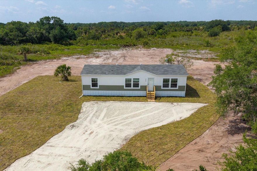 Don’t miss this opportunity to own a brand-new 2026 factory-built Summit model offering modern design, quality craftsmanship, and peaceful country living in the sought-after Prairie/Viking area of Okeechobee.
This beautifully designed home features 3 bedrooms, 2 bathrooms, and 1,369 sq ft of open-concept living space, perfectly laid out for both everyday comfort and entertaining. The split floor plan provides privacy, with a spacious primary suite separate from the guest bedrooms.
Step inside and enjoy upscale finishes throughout, including tray ceilings, crown molding, an upgraded lighting and ceiling fan package, and a bright, airy layout. The kitchen is the heart of the home, complete with a large island, stainless steel appliances, and seamless flow into the family and dining areas.
The primary suite is a true retreat, featuring a large walk-in closet, double vanity, soaking tub, and an upgraded walk-in shower. 
Set on a gorgeous 1.25-acre AG-zoned lot, this property offers endless possibilities—bring your animals, RVs, boats, and more. There’s ample room to add a barn, workshop, garage, or pool while still enjoying wide-open space and privacy.
Additional highlights include:
• Two-toned exterior with horizontal lap and board-and-batten siding
• Sliding glass doors to the backyard
• Interior laundry room with exterior access
• Well, septic, water filtration system, and full setup included
• Turn-key and move-in ready
Conveniently located just a few blocks off main roads for easy access, while still offering a quiet, rural feel. This stunning home comes complete with well, well equipment, septic, steps, skirting, sod, AC, electric, and turn-key for buyer to move right in.
Multiple homes available in the Prairie/Viking area, including move-in ready options and homes nearing completion (30–90 days).
Schedule your showing today and experience the space, freedom, and value this property offers.