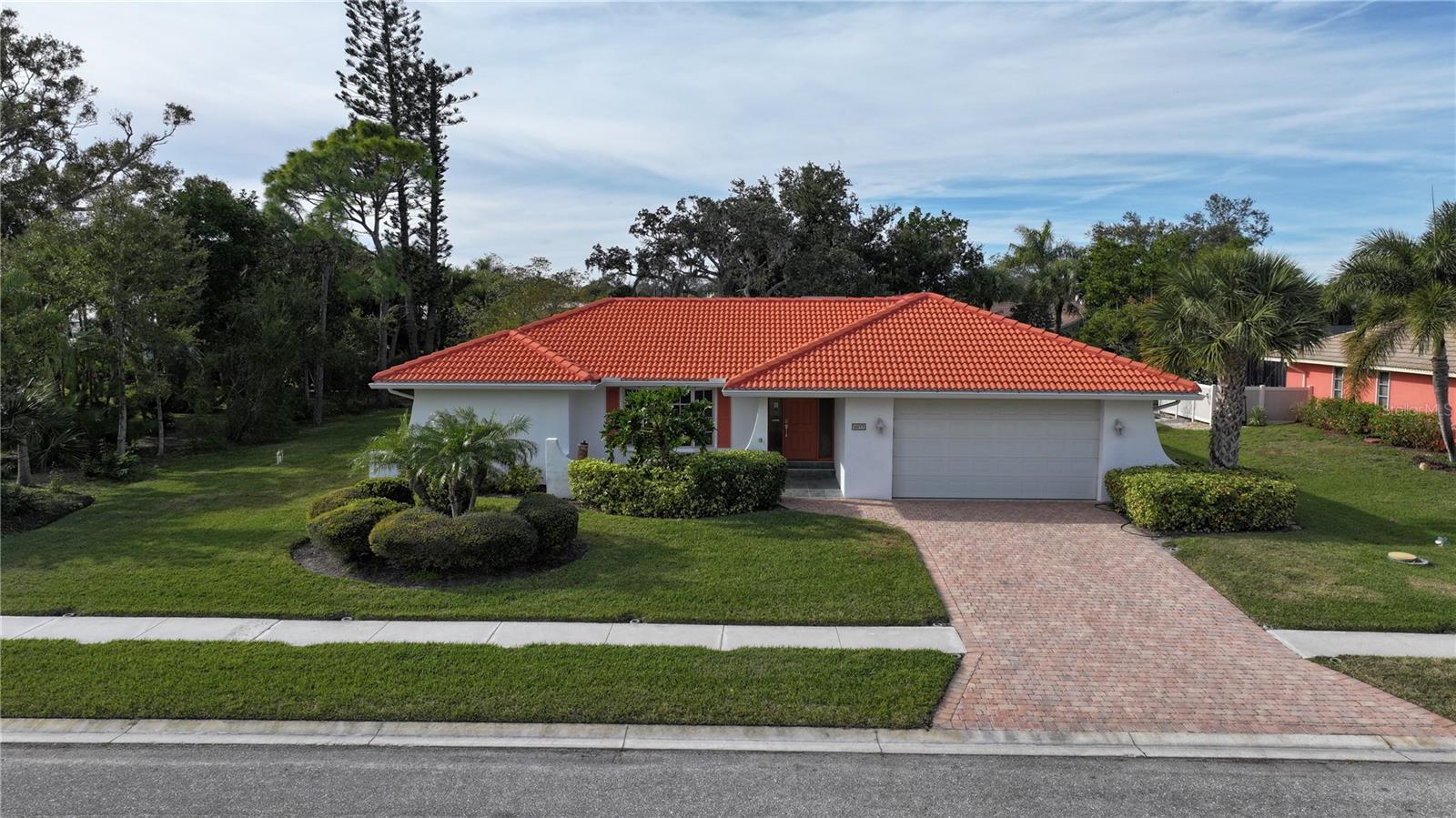 This Sorrento Woods pool home is well maintained and has an updated kitchen with raised wood cabinets and granite counter tops. The family room has a gas fireplace for those cool nights. As you walk up to the home, there is a courtyard sitting area in the front of the home. The pool area has a large, covered lanai to enjoy the views of the pool, Barbecuing and enjoying the large back yard. The sliders to the pool pocket opening up the house to let the breezes in. There is hurricane protection for the home.
Optimally located close to the Legacy Trail, Laurel Nokomis Elementary and Middle School, access to shopping, downtown Venice, I-75, the new Sarasota Memorial Hospital, Nokomis Beach and Venice Jetties. Sorrento Woods has its own 10-acre park with private boat ramp and dock where you can fish.