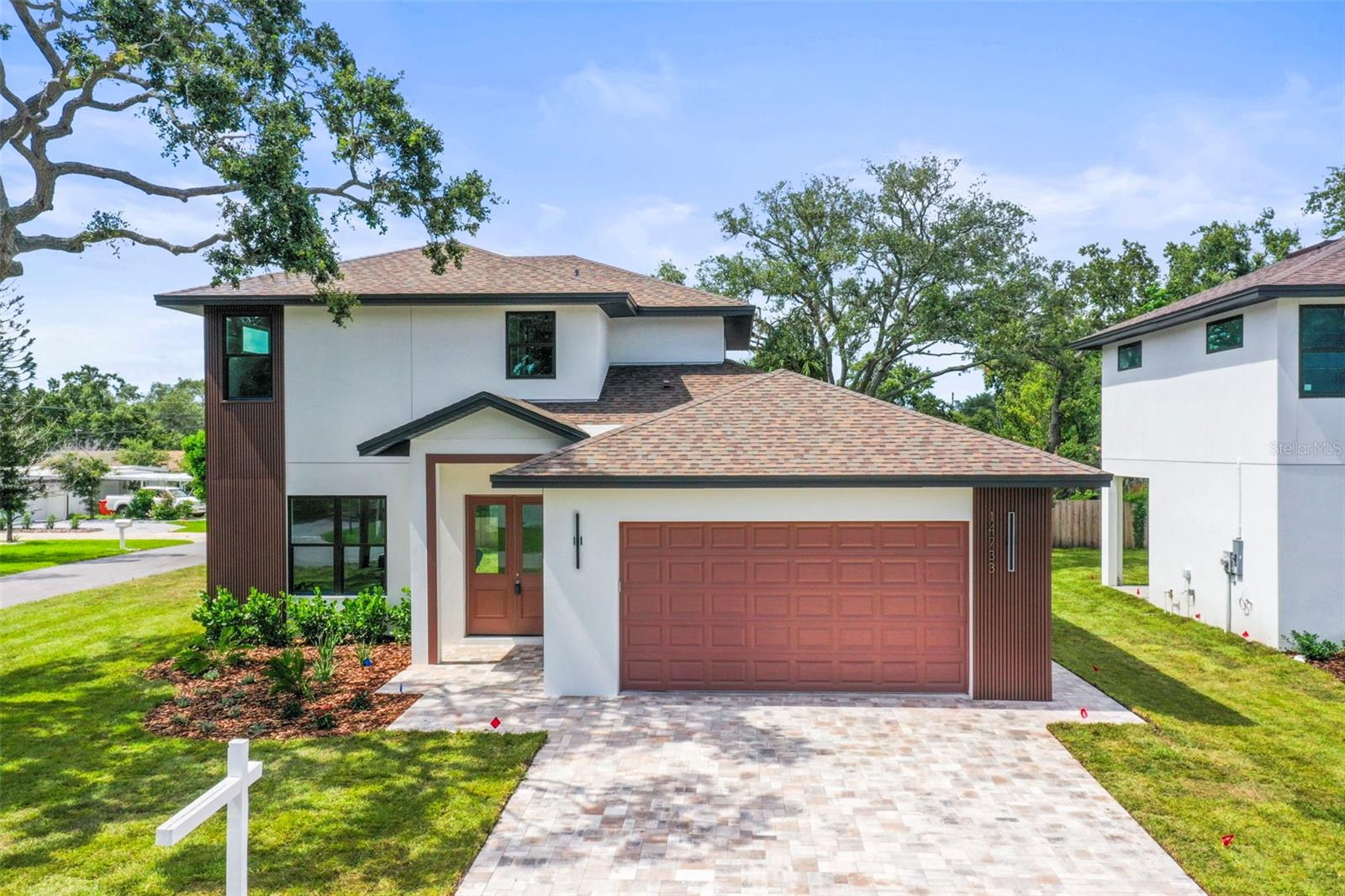 Welcome to your stunning new custom-built home—just 1.5 miles from Indian Rocks Beach and located in desirable Flood Zone X!
This brand-new two-story residence offers 2,197 square feet of thoughtfully designed living space, featuring four bedrooms, two full bathrooms, and a convenient half bath on the main floor. The spacious primary suite is located downstairs and includes a generous walk-in closet. You'll love the open-concept main floor, complete with soaring 10-foot ceilings, warm oak-finish vinyl flooring, and a large under-stair storage area. The beautifully appointed kitchen boasts white shaker cabinets, quartz countertops, stainless steel appliances, a walk-in pantry, and a bright dining area perfect for gatherings. Step outside to a shaded covered porch—ideal for outdoor entertaining or peaceful relaxation. Upstairs, you'll find three additional bedrooms, all with vinyl flooring and oversized closets. Built with durability and efficiency in mind, the home includes high-impact windows throughout. With no HOA and low insurance rates thanks to its new construction and favorable location, this home is a rare find. Agent/builder-owned.?Don’t miss your chance to own a brand-new home in the sought-after Largo/Seminole area!