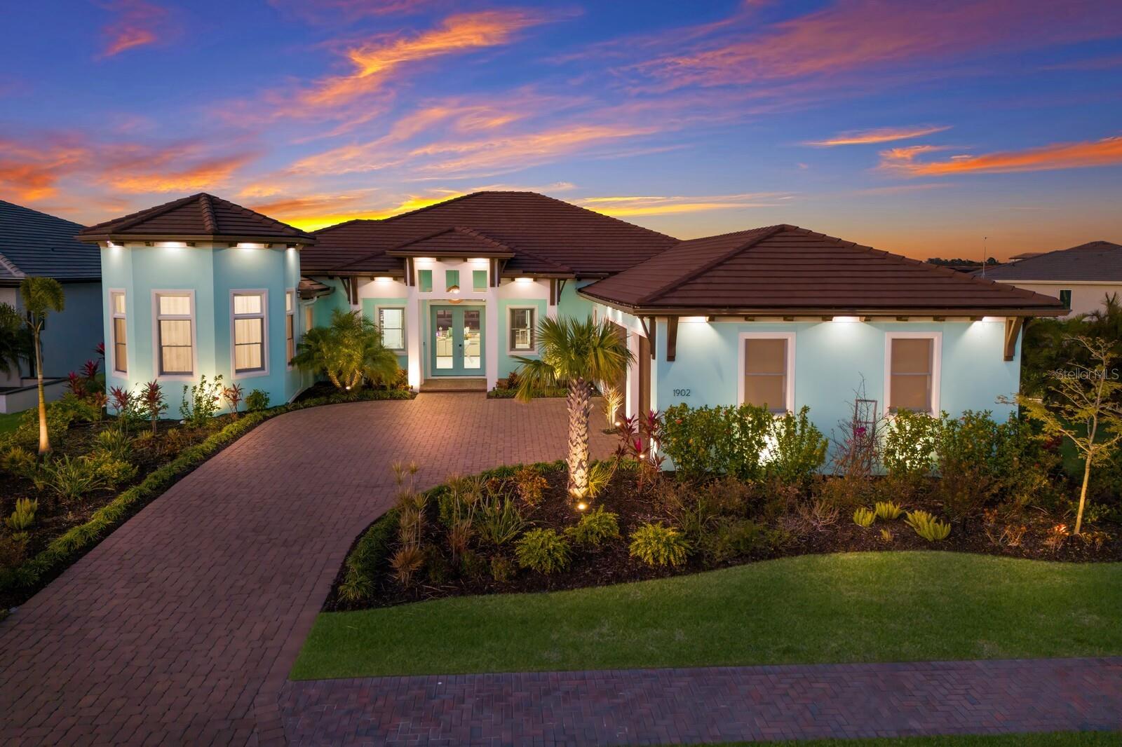 Outdoor living defined in this Custom Home with designer upgrades in every room and more, all located at Water's Edge in The Sanctuary! Having your closest friends over for an al fresco dinner, the Big Game or holidays will never be the same as the 14 seat covered area on the pool deck is unparalleled. Keep your boat on the 16,000# lift off your screened pool - so short rides out to the Manatee River, local restaurants and Anna Maria Island will become the norm...so much to love, it will be hard to choose how to enhance another epic day. Designer touches abound in this Smart Home - just ask Alexa to enhance your showing. Peace of Mind here as well - All windows and Doors are Impact Rated. A thoughtful custom home here that features 2 offices (one being used as a Craft Room that belongs in a Magazine) Split bedrooms, a pool bath, Guest space for the little ones to call their own, Custom Wood working, lighted Tray Ceilings, LED lighting, Induction Top in the Kitchen with separate oven, a combi-oven and more...Should you need to use the Clubhouse, an 8000sqft space awaits, with cooking options, pool table, fitness center and more - plus a private beach and parking spaces for your guests.
Do yourself a favor and add this one to your "list" - if boating and entertaining are important to you, then this home will take you up a few notches and then some!