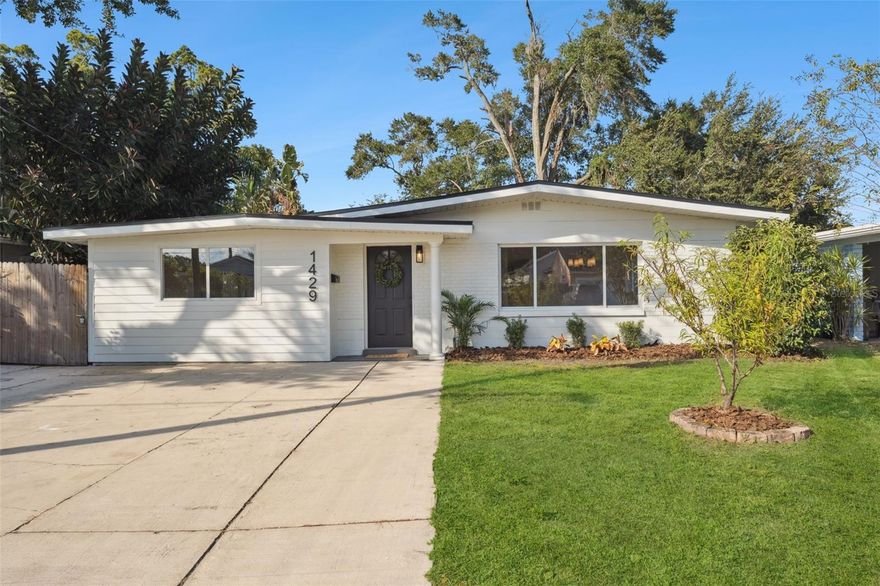 One or more photo(s) has been virtually staged. Completely remodeled 4-bedroom home in the heart of College Park!

This mid-century modern gem has been fully updated from top to bottom, featuring a new permitted roof, new HVAC, updated plumbing and electrical, new energy-efficient water heater, stainless steel appliances, soft-close cabinets, a large kitchen island, fresh landscaping, and more. Every detail has been thoughtfully designed for comfort, efficiency, and style.

Step inside to discover an open-concept layout with luxury vinyl plank flooring, fresh interior and exterior paint, and designer lighting throughout. The chef’s kitchen boasts quartz countertops, custom soft-close cabinetry, floating wood shelves, stainless steel appliances, and a large island perfect for entertaining.

The private owner’s suite offers a spa-inspired bathroom with an extended tiled frameless glass shower and walk-in closet. Two additional bedrooms share a beautifully updated full bath, while the fourth room serves perfectly as an office, studio, play room, or guest suite.

Enjoy outdoor living on the rear patio, complete with a cozy firepit, and a fully fenced backyard ideal for relaxing or hosting gatherings.

Situated just minutes from Edgewater Drive’s shops and dining, Dubsdread Golf Course, Lake Ivanhoe, and Downtown Orlando, this home perfectly blends modern luxury with classic College Park charm. Located only a few houses down from the light-use rail corridor along N Orange Blossom Trail, the nearby transfer station experiences minimal activity, maintaining the peaceful neighborhood atmosphere that makes College Park so desirable.