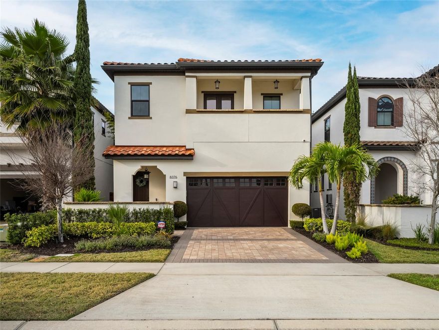 Best Location in Orlando: absolutely captivating and nestled  in the esteemed Dellagio community of Dr. Phillips, this custom-designed residence exudes elegance and luxury. Inspired by Mediterranean Tuscan architecture, offering the finest in luxury living indoor & outdoor. The spacious open floor-plan is complimented with high ceilings throughout with walls of glass that floods the home with natural light. Other features are the gourmet chef’s kitchen with upgraded cabinets, beautiful tiled back-splash, oversized kitchen sink, Gas cook-top, beautiful quartz counter tops, extended island with breakfast bar & walk-in pantry. Also there is designated area with adjacent wine cellar with glass entrythe wine enthusiasts and additional walk-in pantry. Dining room is elegant with doors opening up to an outdoor sitting area featuring a linear gas fireplace and privacy wall decorated. Ascending the staircase, you'll find a spacious bonus room and a large owner's suite complete with French doors leading to a private balcony oasis. The home also features two additional bedrooms, each with its own ensuite, custom wood walk-in closets, and a separate laundry room.

The moment you step into the foyer, you'll be enchanted by its thoughtful design and meticulous attention to detail.
This home boasts an array of upgrades and features that surpass even the model home. The open floor plan is perfect for entertaining, with voluminous ceilings and an exquisite gourmet kitchen that is a chef's dream. *House with Solar Panels*

DELLAGIO is located in the heart of Dr. Phillips is the most desirable area in Orlando, just steps away from a charming retail shopping village, this residence offers a lifestyle of convenience and sophistication. With close proximity to world-renowned golf courses, International Drive, and the area's major attractions, this home truly offers the best of Florida living.

Don't miss the chance to own a piece of paradise in one of Orlando's most sought-after communities.