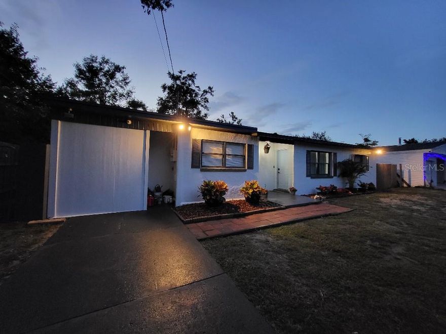 Move in ready family home with luxury finishes and a large fenced backyard. This is a 3 bed/ 2 bath property with an office big enough to be a 4th bedroom. It offers a split layout with the master bedroom, walk in closet, and master bath on one side and the other 3 rooms on the opposite side of the house. The 10 x 10 bonus room can be used as an office, game room,  or simply storage. All renovations have been completed in 2025. New Flat roof, new drainfield, new 3 ton A/c system, new kitchen cabinets and butcher block countertops, new porcelain tile flooring, and paint inside and outside. Led flush mount fans have been added throughout the home and the lighting is excellent. This is a must see and feels much bigger in person. This property has a prime location in thw golden triangle, connecting Mount Dora, eustis, and Tavares. 2 minutes from the famous downtown mount dora without all the traffic. 2 minutes from walmart, target gas, banks, post office, elementary school, and all the major restaurants.  Fully fenced backyard has room for pets, sheds, or even a pool.  This charming block home has a solid foundation and all the upgrades to accommodate your family.