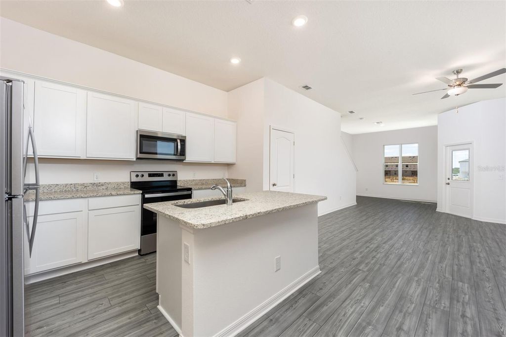 Photo of 860 Poppy Lane, Dundee, FL 33838 (MLS # TB8434414)
