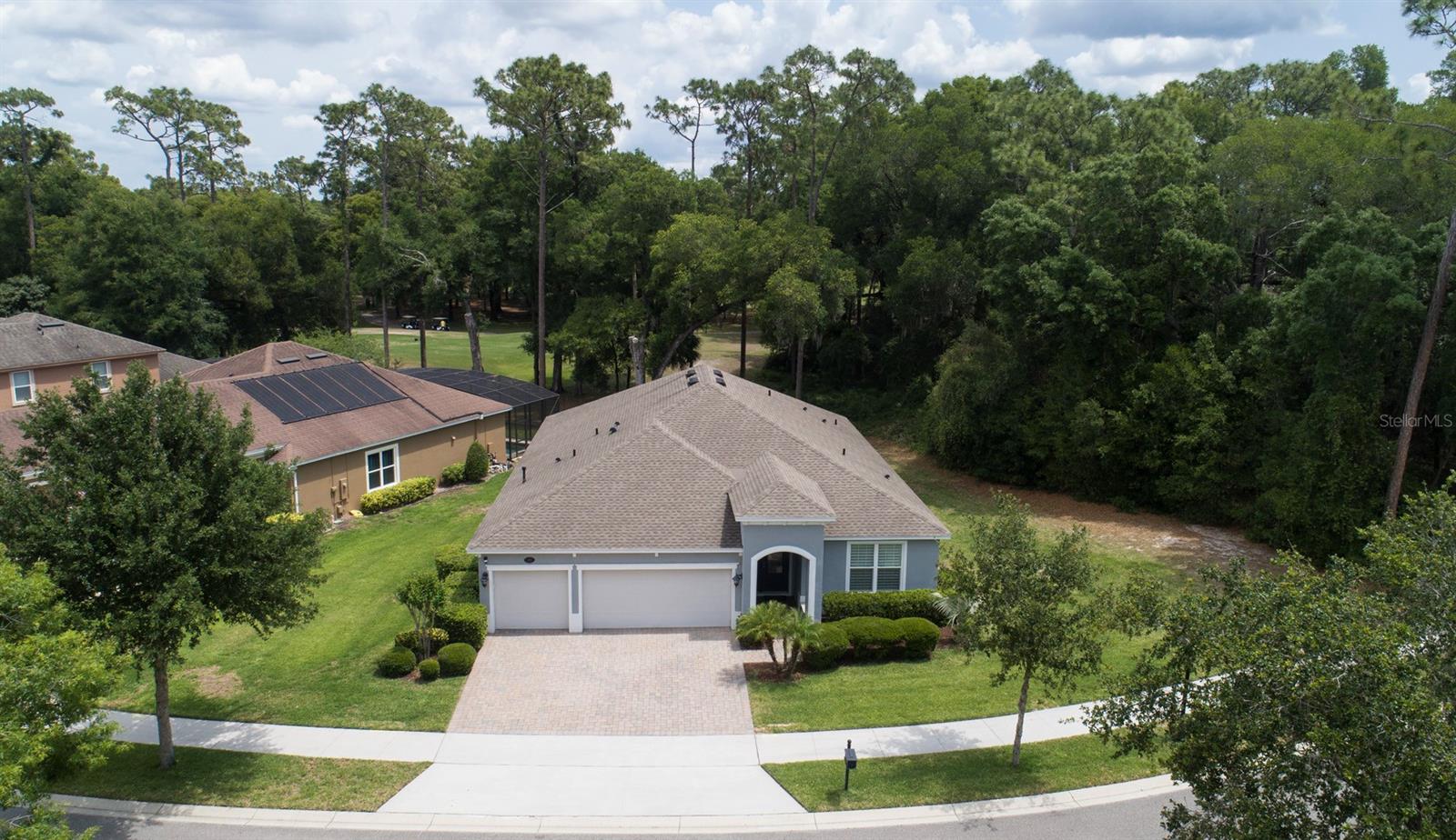 Welcome to your dream home in the heart of Victoria Hills, one of Central Florida’s most desirable golf communities.  Perfectly situated on the 7th tee box, this meticulously maintained home offers breathtaking views of the fairway, stunning sunsets, and peaceful ambiance of golf course living.  This 3 bedroom, 3 bathroom home boasts over 2300 square feet of beautifully designed living space, not including a covered screened porch.  Step inside to discover bright, open concept floor plan with high ceilings 8 foot doors throughout and tile floors. The kitchen is a chefs delight, featuring granite countertops, stainless steel appliances, large center island and custom cabinetry.  The adjoining dining area and spacious living room provide for the perfect layout for entertaining, all while overlooking your private, screened lanai and the golf course.  Retreat to the expansive master suite offering golf course views, a tray ceiling, spa like en-suite bath with dual vanities, walk in shower and a generous walk in closet.  Two additional bedrooms are perfectly separated from the master suite offering comfort and privacy for visitors or multi-generational living.  A flex room/den adds even more versatile space.  Additional features, 3 car garage with work bench, interior laundry room with cabinetry, sink and small closet.  Exterior security cameras and reclaimed water irrigation system.  Victoria Park has resort style amenities including the Ron Garl designed 18 hole championship golf course, community pools, clubhouse and restaurant, fitness center, tennis, pickleball courts, walking trails, water features, and playgrounds.  The Village center has shops, restaurants and medical offices.  Located just minutes to downtown Deland, Stetson University, Publix, easy access to I-4/to Orlando or Daytona Beach.
