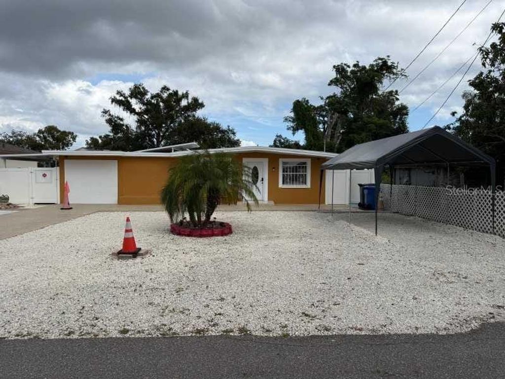 Photo of 7409 N Tampania Avenue, Tampa, FL 33614 (MLS # TB8445260)