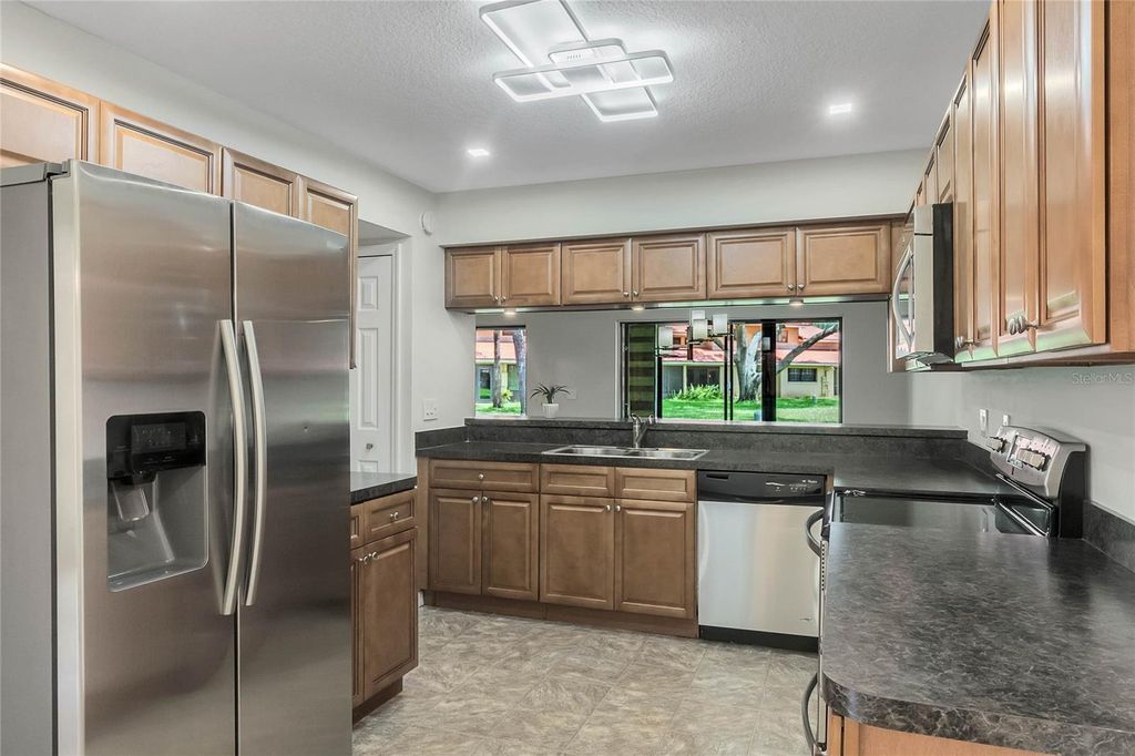 Photo of 8235 Ambrose Cove Way, Orlando, FL 32819 (MLS # O6392217)