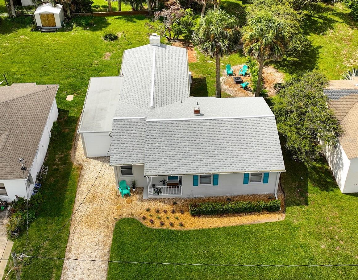 Welcome to this BEACHSIDE single-family home just STEPS TO THE BEACH! Literally walk by 3 houses and you’re at the Zelda Blvd Beach Access! It's on a SPACIOUS LOT at 0.19 ACRE. You'll love the EXTRA LARGE FAMILY ROOM with HURRICANE-RATED WINDOWS in the rear addition. Beautiful original HARDWOOD FLOORS, refinished just a few years ago, and a PRIVATE GARAGE with HURRICANE WIND-RESISTANT MOTORIZED DOORS. Updates include NEW EXTERIOR PAINT (2025), ELECTRICAL PANEL (2018), ROOF (2018), HVAC (2019), and BLOCK CONSTRUCTION for long-lasting strength. The WATER HEATER (2011) is also in great working order. 2 of the bedrooms have BUILT-IN CLOSETS AND DESKS. LARGE BACKYARD has been cleared for more usable space, and there’s even an OUTDOOR SHOWER to rinse off sandy feet after a beach day. The home’s elevation is another major perk: approx 14 FEET ABOVE SEA LEVEL with NO history of water damage! WASHER & DRYER stay with the home, and it's CITY WATER & CITY SEWER CONNECTION, with NO HOA. Location is where this property truly shines! Walk to the beach or head down the street to SCHNEBLY RECREATION CENTER (FREE pickleball, basketball, volleyball, playgrounds, and fitness classes). Everyday conveniences are close by with PUBLIX SUPERMARKET only 1 mile away, and the DAYTONA INTERNATIONAL SPEEDWAY is just a 15 min drive. Enjoy the “WORLD’S MOST FAMOUS DAYTONA BEACH” Main Pier a few miles down, and VEHICLE BEACH ACCESS at University Blvd. 2 miles north is ORMOND BEACH and a DOG BEACH PARK too! With thoughtful updates, coastal charm, and a prime location near amazing amenities, 476 Zelda Blvd is the perfect opportunity to enjoy the Florida beach lifestyle. Schedule a tour today!
