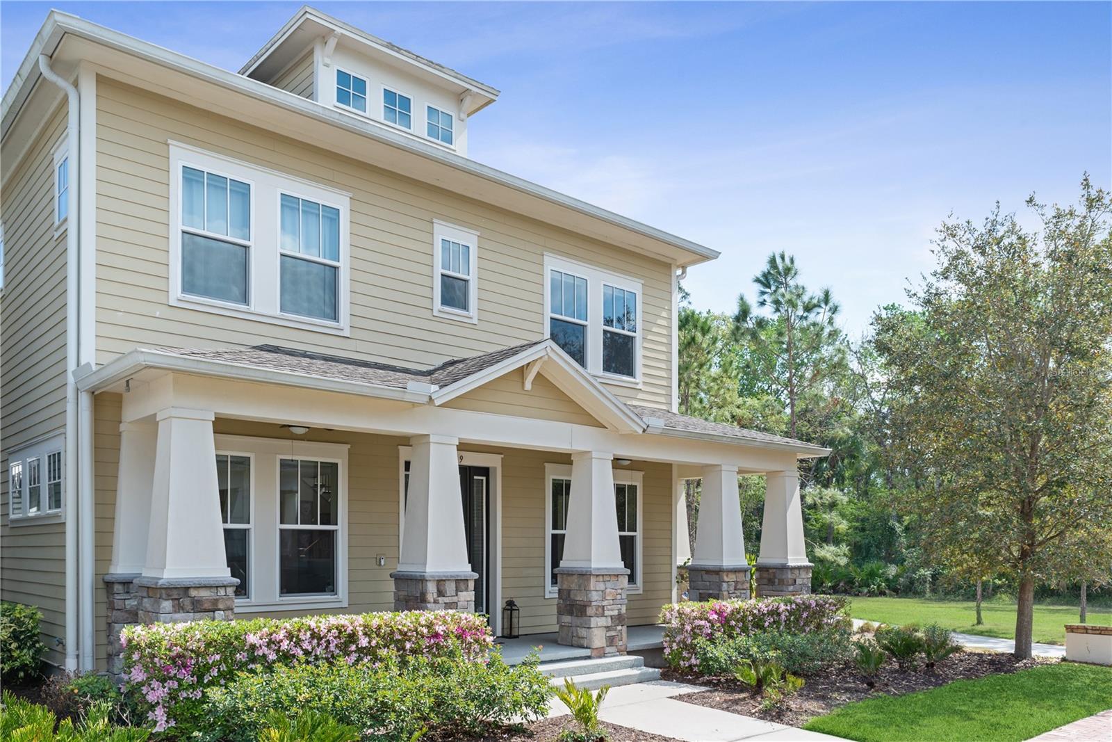 Come Live and Play in Celebration! This custom built 4 bedroom/4 full bath Anastasia Model by award winning David Weekley Homes is located in Spring Lake of Celebration on a corner premium lot that includes a covered wrap around porch that leads to your outdoor living space to enjoy the panoramic water, wooded preserve views and star gazing from the beautifully paved side patio with an open landscaped privacy fence. The front door is just steps away from the Spring Lake Community Pool and Fitness Center. Also enjoy and reflect at the Spring Lake Park located across from the pond! The town of Celebration features a championship golf course, exciting community events and resident activities all year round, including outdoor movies, live music and more! There is also a private dog park for all sizes, additional community parks, multiple pools (heated and non heated) and over 26 miles of walking and biking trails leading to Celebration restaurants, businesses, parks, pools, and shops. This home is quick and simple access to the Orlando International Airport and to Walt Disney World, Universal, Sea World and all other attractions east, west, north and south! The first level living is an open floor plan with an entertainment style kitchen, dining room, office/den and living room with a private first floor bedroom and full bath. On the second floor, this home features 3 second floor bedrooms, 2 of the 3 bedrooms have private full bathrooms. perfect for guests and multi-generation living! There is a spacious open loft with a wall of windows overlooking the pond and wooded preserve that captures sunrises, sunsets and star gazing. From the loft, retreat to the private entrance to the spacious main bedroom suite, with a private bathroom and walk in closet. Also, on the second floor, there are 2 additional bedrooms and 2 bathrooms. One bedroom includes a private bathroom for a private living. The third upstairs bathroom is conveniently located in a private hallway. Also located on the second floor is the laundry/utility room filled with sunshine! This home features an extended garage, Hurricane windows, Tesla Solar (2021) - Paid in Full. Average Duke Energy Bill $30-35 with Solar! New HVAC System (2021) with UV Light and whole house dehumidifier. Complete home & dryer vent cleaning (2023). Electric car outlet. Two wall mounted Sony TV's stay. New blinds (2022) throughout home. Simply Safe Wireless Security System with 3 outdoor, indoor cameras, 2 motion detectors stay. New carpet throughout(2021). HOA Fee includes this home's lawn maintenance, trash and recycling services! CDD fees are included in the annual property tax amount. All information deemed correct, not guaranteed. Video and/or audio surveillance with recording capability in use on these premises. Conversations should not be considered private. Proof of Funds and/or Mortgage Pre Approval required with all offers.