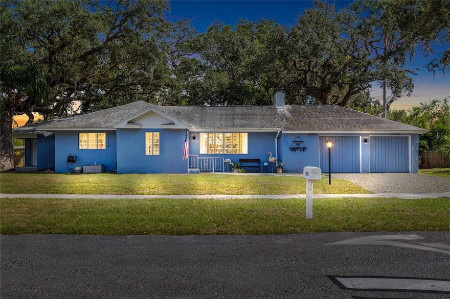 Tucked just a few streets south of the Dunedin border, this 1946 block home on Pinecrest Way offers a rare opportunity that blends classic Florida character with untapped potential. With over 2,400 heated square feet, this three-bedroom, two-bath residence features a family room, two fireplaces, a spacious rear porch, and multiple entry points, inviting someone with vision to reimagine or restore it into something truly special. Resting on three lots beneath a canopy of mature oak trees, the property’s value extends far beyond the home itself, offering endless options for those looking to start fresh, build new, or develop multiple homesites. The two-car garage and expansive yard provide plenty of room for a pool, RV, or boat, making it as practical as it is full of possibility. The location anchors you near everything that makes Clearwater and Dunedin so desirable. Located nearby to the Pinellas Trail, with convenient access to Edgewater Drive and the scenic St. Joseph’s Sound, and just minutes from both the Toronto Blue Jays and Philadelphia Phillies spring training facilities. Head five miles north to Honeymoon Island or five miles south to Clearwater Beach, and benefit from a location not designated within a mandatory flood insurance zone. Whether your dream is to revive a piece of Old Florida charm or unlock the land’s development potential, this property is ready for its next chapter.