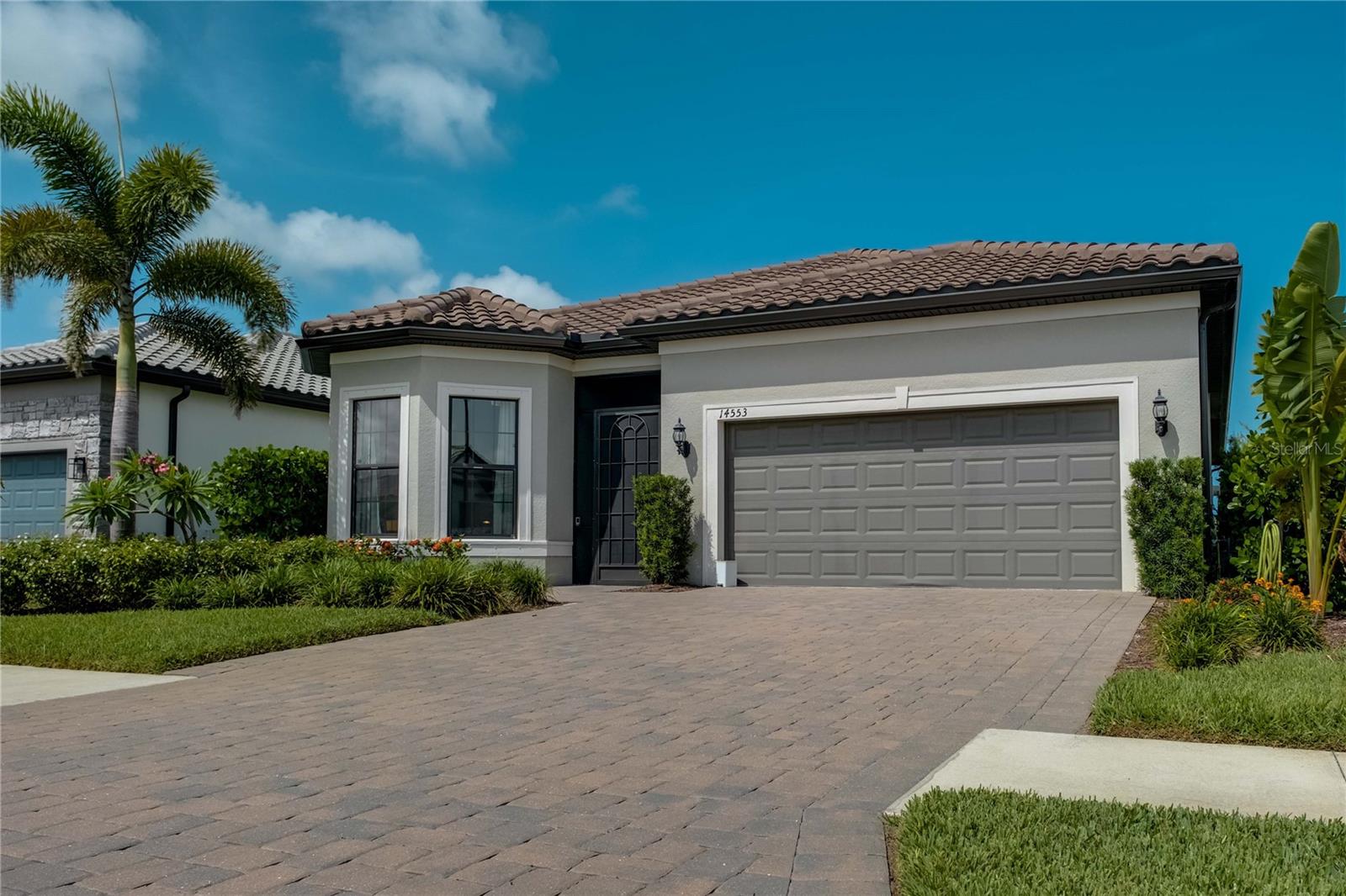 Impeccable Sunset Pool Home in Talon Preserve a Luxury Resort Style Community Minutes from the Beach. Discover your Florida dream lifestyle in this beautifully upgraded 2-bedroom, 2.5-bath home with a private pool, spa, and extended garage, nestled in the highly sought-after gated, maintenance-free community of Talon Preserve in Nokomis. Ideally located just minutes from I-75, hospitals, golf courses, and beaches, this home offers an exceptional blend of convenience, luxury, and tranquility. Whether you're seeking a full-time residence or a seasonal retreat, this home delivers comfort, style, and resort-style living in one of Sarasota County’s most vibrant new communities. Home Features. Gourmet kitchen with 42” cabinets, quartz countertops, stainless steel appliances, oversized island, and a walk-in pantry with a cozy breakfast nook. Open-concept great room with pool and water views, ideal for entertaining or relaxing. Primary suite overlooking the pool, with 2 closets and featuring an expansive main walk-in closet, dual vanities, and a spa-style shower. Guest suite with bay windows and a private en-suite bath perfect for visiting friends and family. Flexible office/den with double doors for privacy and includes a closet. Laundry room with added shelving, and extra storage space; and an extra, walk-in hall closet for storage or an expanded pantry. Ceiling fans with remote controls in every room for comfort and energy efficiency. Resort-Style Outdoor Living. Private heated saltwater pool with sun shelf and built-in oversized spa, perfect for relaxation and watching the sunset. Screened lanai with ample space for outdoor dining, lounging, or entertaining with Travertine Tile. Outdoor Kitchen Island with Grill, Refrigerator and seating for 3 already set up with gas line. Premium lot with lake view for added privacy and serenity. Garage & Lot Enhancements. Extended 2-car garage with an additional 4-foot depth (80 sq. ft.)—ideal for storage, golf cart, or hobbies. With a 240 Volt outlets for charging your Electric Vehicles. Professional landscaping and well-maintained curb appeal. Located in Flood Zone X—no flood insurance required. World-Class Amenities at Talon Preserve 18,000 sq. ft, literally a 2 minute walk from your home. Grand Clubhouse with on-site restaurant & bar, Resort-style pool with lap lanes, beach entry, spa, waterfall, and splash pad, Fitness center, movement studio, and wellness programs, Tennis, pickleball, bocce ball, fire pit, dog park, Card room, craft room, arcade, game spaces. Direct access to the Legacy Trail for biking, walking, or running. 3 minutes to I-75. 5 minutes to Sarasota Memorial Hospital Venice Campus,7 minutes to Nokomis Beach,15 minutes to Downtown Venice and 25 to Sarasota. With Convenient to shopping, restaurants, and golf. Low-Maintenance, High-Enjoyment Living. Perfect for those seeking an active, social lifestyle in a scenic setting without the hassle of exterior upkeep. HOA includes landscaping, irrigation, gate maintenance, and full use of all amenities.