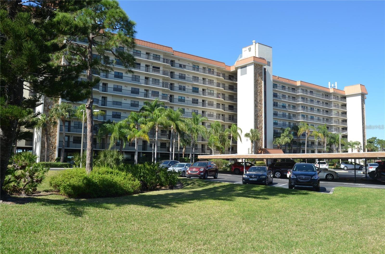 One or more photo(s) has been virtually staged. Enjoy the serenity of the wonderful water views over the Bayou while sitting on your screened in porch on the top floor of this building. The grounds are nicely kept and offer tennis courts, a club house, board walks and a pool area that invites for gatherings in this friendly community. The unit was a long term rental for many years. It has tile flooring throughout and has a spacious living room, dining combo. The primary bedroom suite has a walk-in closet and access to the west-facing balcony. With some TLC (bathroom and kitchen remodel) this unit could become the gem of the neighborhood. There is an assigned parking spot in the covered garage with a storage area.
