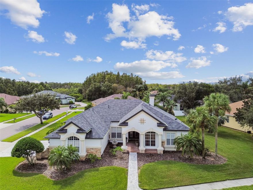 Immaculate, Pride-of-Ownership, Arthur Rutenberg St. Augustine Custom Home in the Gated Enclave of Strathmore Village of Oakstead! 
4 bedroom, 3.5 bathroom, plus den/home office, formal living room, formal dining room, 3 car-garage, over 3,374 heated sqft (4,571sqft total) and expansive, covered and screened-in pool, spa and patio! 

Upgrades and Updates Include: New Roof (2021), New Water Heater (2024), New Water Softener (2024), New Dishwasher (2025), Pool Resurfaced (2020), Stone Pavers (2022), European Round Gutters (2021) and many custom details throughout!

Additional Features:
Custom wood built-ins in Home Office, Hardwood Floors Throughout, Ceramic Tiles in Wet Areas, Carpets Only in Bedrooms, Cast stone fireplace, Lighting and floating vanity in all bathrooms, Tray ceiling and lighting in primary bathroom, upgraded light fixtures and ceiling fans throughout, kitchen with outside vent, outdoor kitchen also with vent, trash compactor, island with microwave, whole house speaker system with controls in multiple rooms, spa rocks in pool bath, wonderful landscape with fountain and more!

Dream Home Office with custom wood built-ins and the highlight of this home...a custom, thoughtfully engineered suspended model train track with lights ready for your engine and power source to make this space come to life!

Oakstead is a highly desirable, natural gas community that offers Resort Style Amenities including Adult and Kiddie Pools, Clubhouse, Fitness Center, Tennis and Pickle Ball Courts, Covered Playground and scenic 3-mile walking trail and more making this an Amazing Place to call Home! Located on SR-54 near US-41, home provides easy access to I-75, I-275 or The Veterans Expwy for access to Tampa’s Airport, Shopping, Dining and Entertainment! Call today for your private tour!
***
Property Website and Matterport 3D Tour --> https://realestate.febreframeworks.com/sites/opnvkkj/unbranded