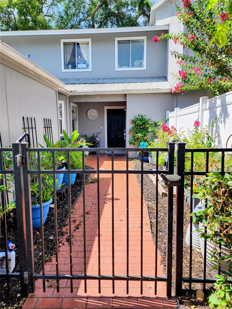 Looking for a updated townhome in a great community and convenient location? Then this house is for you. This townhome condo has three bedrooms, 2/5 baths, 1775 square feet, a private gated front courtyard and a screened porch room. The decorator kitchen has been enlarged to include an island, all lower cabinets have pull-out shelves. Appliances replaced in 2017 along with two new air conditioners in 2025. Hard surface floors in all but one bedroom. All of the bathrooms have been remodeled with a soaking tub in the master bath. Storage space galore with two closet in the master and a loft that can be use for storage. A large foyer closet was added during the kitchen remodel. The building was reroofed and painted in 2022. Parking in the one car garage and in the driveway. The association fee of $613 monthly includes internet and cable. Oak Harbour is a beautiful tree-line community on Lake Orienta with boat parking available and a covered dock for fishing or watching the sunset. There is a large clubhouse with pool tables, a ping pong table, a library and game rooms. The fitness center, tennis/pickleball, basketball and shuffleboard courts and a second pool rounds out the amenities at Oak Harbour. Oak Harbour is a pet-friendly community with no breed or weight restrictions. Conveniently located near Altamonte Mall, Advent Health Hospital, restaurants and all Central Florida attractions.