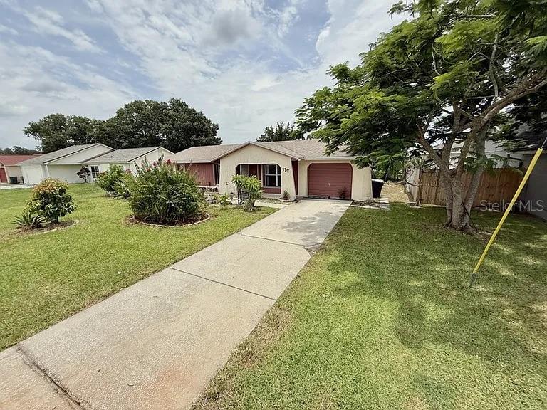 Welcome to 716 Caribou Drive, a bright and spacious 2-bedroom, 2-bathroom home with a flexible additional space that can function as a third bedroom or home office, located in the quiet, family-friendly neighborhood of Poinciana Village 3. This single-family residence features a thoughtful layout with a spacious kitchen and dining area, a brand-new dishwasher (2024), a cozy living room filled with natural light, and a fully enclosed lanai—perfect for relaxing or entertaining with garden views. The property is equipped with hurricane shutters on all windows and doors, providing added peace of mind. The low $90/month HOA includes access to a community pool, fitness center, basketball court, parks, playgrounds, and even cable and internet, offering exceptional value. The home is conveniently located just minutes from Publix, Walmart, Home Depot, Lowe’s, and the Poinciana Medical Center, with easy access to major roadways like Poinciana Parkway, Highway 17-92, and I-4. Major attractions such as Walt Disney World, Universal Studios, and the upcoming Epic Universe theme park are only 35 minutes away.
Poinciana is growing rapidly, with new developments bringing national retailers and restaurants to the area. Residents will also benefit from the upcoming retail additions at the SunRail station. Families will enjoy abundant outdoor recreational options within 15 miles, with popular spots like Vance Harmon Park and Poinciana Community Park offering a mix of sports courts, playgrounds, skate parks, and expansive green spaces. For date nights or exploring the local food scene, there’s a wide variety of restaurants offering unique culinary experiences. Fitness enthusiasts will also appreciate the proximity to top-rated gyms. Whether you’re looking for tranquility, convenience, or a well-rounded lifestyle, this home offers comfort and value in a rapidly developing community—perfect for families and professionals alike.
