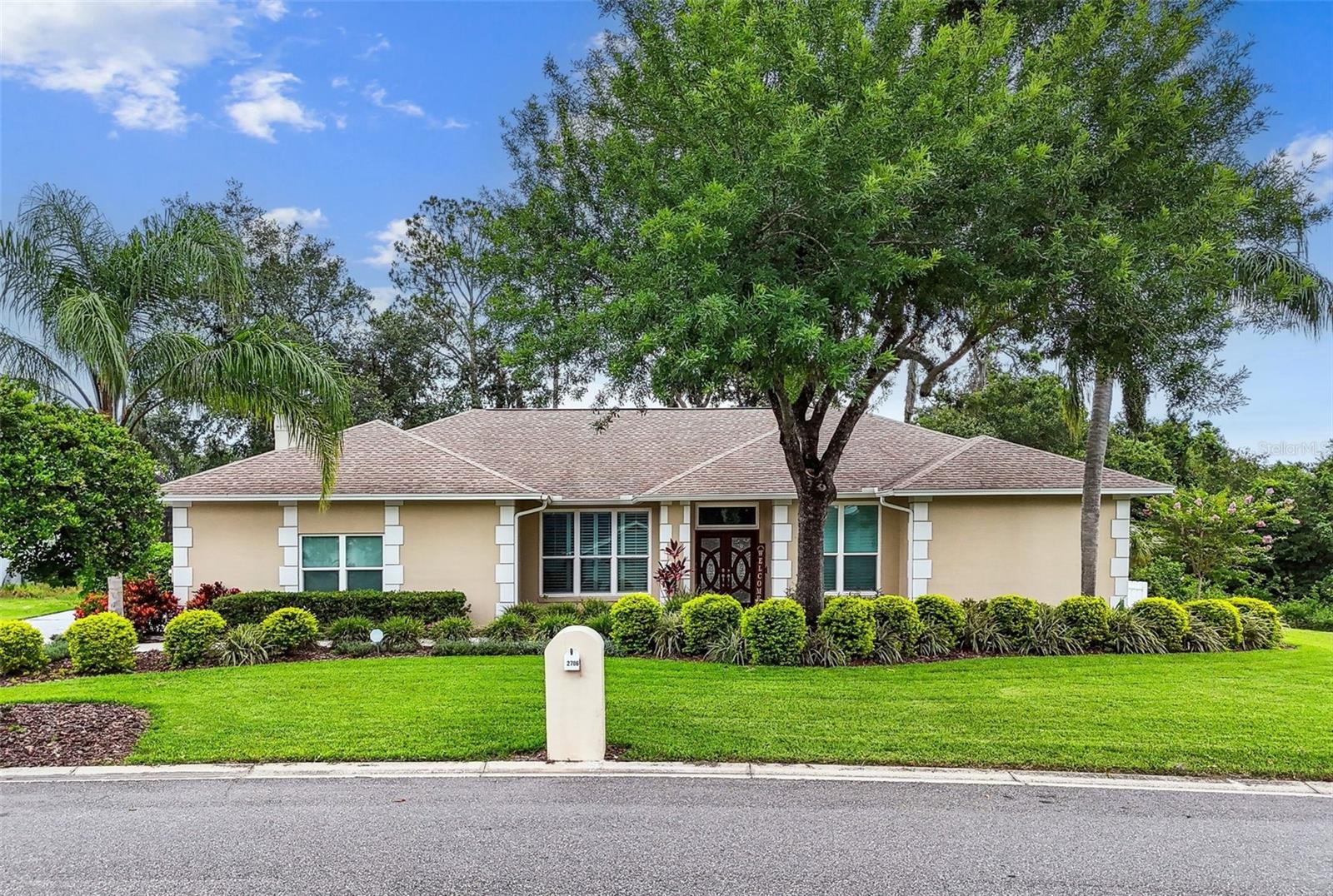 Welcome to 2706 S Fairway Drive…A Private Oasis in Walden Lake’s Coveted Tanglewood Section. Nestled on a lush, tree-lined 1-ACRE LOT with tranquil CONSERVATION VIEWS, this FULLY REMODELED 4-bedroom + DEN (has a closet and could act as a 5TH BEDROOM), 2-bathroom home is a rare find. Located on a quiet, NO-THROUGH-TRAFFIC street surrounded by other custom homes, this peaceful retreat offers the best of Florida living-privacy, sustainability, & plenty of space to gather & grow. From the moment you arrive, you’ll appreciate the immaculate curb appeal, a large driveway, & an oversized side-entry 2-car garage. SOLAR PANELS installed keep utility costs incredibly low - offering savings that can feel like having an extra $45,000 paid off on your mortgage! Step through the stunning CIRCULAR WOOD DOUBLE GLASS ENTRY DOORS & prepare to fall in love. Inside, gorgeous WOOD-LOOK PORCELAIN TILE flows seamlessly through every main living space & bedroom - there’s NO CARPET anywhere. Sunlight pours through large windows & sliders, filling each room w/natural light and a welcoming warmth. The open layout begins w/a bright, airy living room and formal dining area perfect for family dinners & special gatherings. At the heart of the home, the gourmet kitchen overlooks a spacious family room highlighted by a charming WOOD-ACCENT FIREPLACE - ideal for cozy evenings in. The kitchen itself is a dream: WHITE SHAKER CABINETS, sleek STAINLESS-STEEL APPLIANCES including a French door refrigerator, GRANITE COUNTERS, a large island NAVY LEATHERED GRANITE TOP, w/stylish pendant lighting, & plenty of storage including a BUILT-IN PANTRY. There’s even a passthrough window to the back porch for effortless indoor-outdoor entertaining. Tucked privately on one side of the home, the expansive primary suite is a true retreat w/huge walk-in closet & a spa-like en suite bathroom. Relax in the STAND-ALONE SOAKING TUB or enjoy the luxurious TILED WALK-IN SHOWER w/DUAL SHOWER HEADS & CUSTOM TILE ACCENTS. DUAL GRANITE-TOPPED VANITIES & classic brick-pattern tile flooring. Across the home, 3 additional bedrooms offer privacy for family or guests and share a beautifully updated bathroom w/pool access - complete w/large granite double vanity & a tub/shower combo. THE DEN HAS A CLOSET could act as a 5TH BEDROOM & features elegant French doors, is perfect as a home office, nursery, or playroom to suit your family’s needs. TRIPLE GLASS SLIDERS FROM THE MASTER SUITE & LIVING ROOM, POCKET & DOUBLE SLIDERS FROM THE KITCHEN, & BACK BEDROOM wide to create a seamless transition to your outdoor sanctuary. The spacious covered porch is made for entertaining & overlooks a sparkling pool & spa, surrounded by new screening, an UPDATED DECK WITH TRU GRIT SAND FOSSIL COATING, and a charming WHITE VINYL PICKET FENCE for privacy & safety. The conservation area to the right of the home provides the ultimate peaceful backdrop w/frequent visits from local birds & wildlife. Additional features include: * DOUBLE-PANE, ENERGY-EFFICIENT VINYL WINDOWS (replaced 2018)* PLANTATION SHUTTERS ON FRONT WINDOWS* 80-GALLON WATER HEATER* WATER SOFTENER *OVERSIZED TWO-CAR GARAGE with attic access for extra storage *NEW GAS HEAT PUMP FOR THE SPA *Fully fenced backyard around the pool area. Living in Walden Lake means enjoying miles of scenic lakeside trails, a large fishing lake and dock, sports fields, two dog parks, a toddler playground, and a welcoming sense of community - all with a VERY LOW HOA FEE AND NO CDD.