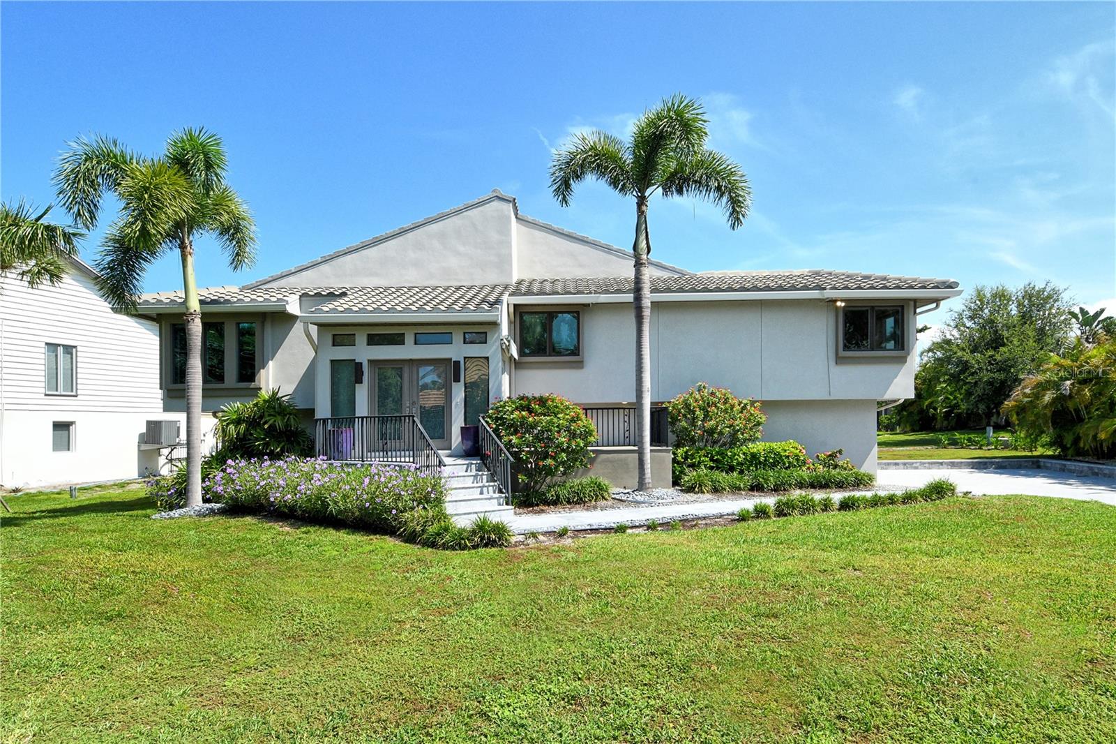 Welcome to this elevated retreat in the sought-after Bayou section of Bay Isles—a seamless blend of sophisticated design and relaxed coastal elegance. Encompassing nearly 2,100 sq. ft. of sunlit interiors, this residence offers an open-concept floor plan with soaring vaulted ceilings, creating an airy, inviting ambiance ideal for both everyday living and effortless entertaining. The expansive family room transitions beautifully into the contemporary eat-in kitchen, featuring clean, high-end finishes, abundant cabinetry, a large central island, and top-of-the-line stainless steel appliances that will delight. Thoughtful details such as graceful archways, ambient lighting, and tasteful materials add refined character throughout. Originally a 3-bedroom design, the home has been artfully reimagined to offer 2 bedrooms plus a dedicated office space—perfect for today’s flexible lifestyle. The oversized primary suite is a private sanctuary with a generous walk-in closet and a beautifully remodeled spa-like bath complete with double sinks and a fully tiled walk-in shower. The second bedroom is equally well-appointed, with direct access to an updated full bath. Sliders from both the kitchen and the primary suite open to the expansive screened upper-level deck with skylights—an ideal setting for al fresco dining, morning coffee, or sunset relaxation while overlooking the private lap pool, inviting patio, and meticulously refreshed landscaping. This residence offers true lock-and-leave convenience with a newer roof, advanced drainage system, updated landscaping, and low-maintenance, higher-end finishes that make it virtually maintenance-free. A rare 3-car garage provides ample space for vehicles and storage.
Residents of Bay Isles enjoy access to the exclusive Bay Isles Beach Club, where sugar-white sands and the Gulf’s turquoise waters await. Enjoy proximity to the Longboat Key Club’s world-class golf, tennis, and pickleball facilities, as well as the LBK Marina. Daily conveniences—including Publix, the Caron Family Pavilion, and town services—are just moments away. A short drive brings you to the fine dining, boutique shopping, and cultural treasures of St. Armands Circle and downtown Sarasota, with Sarasota-Bradenton International Airport only 15 minutes away. This is Longboat Key luxury at its finest—simply move in, unpack, and embrace the effortless resort lifestyle you deserve.