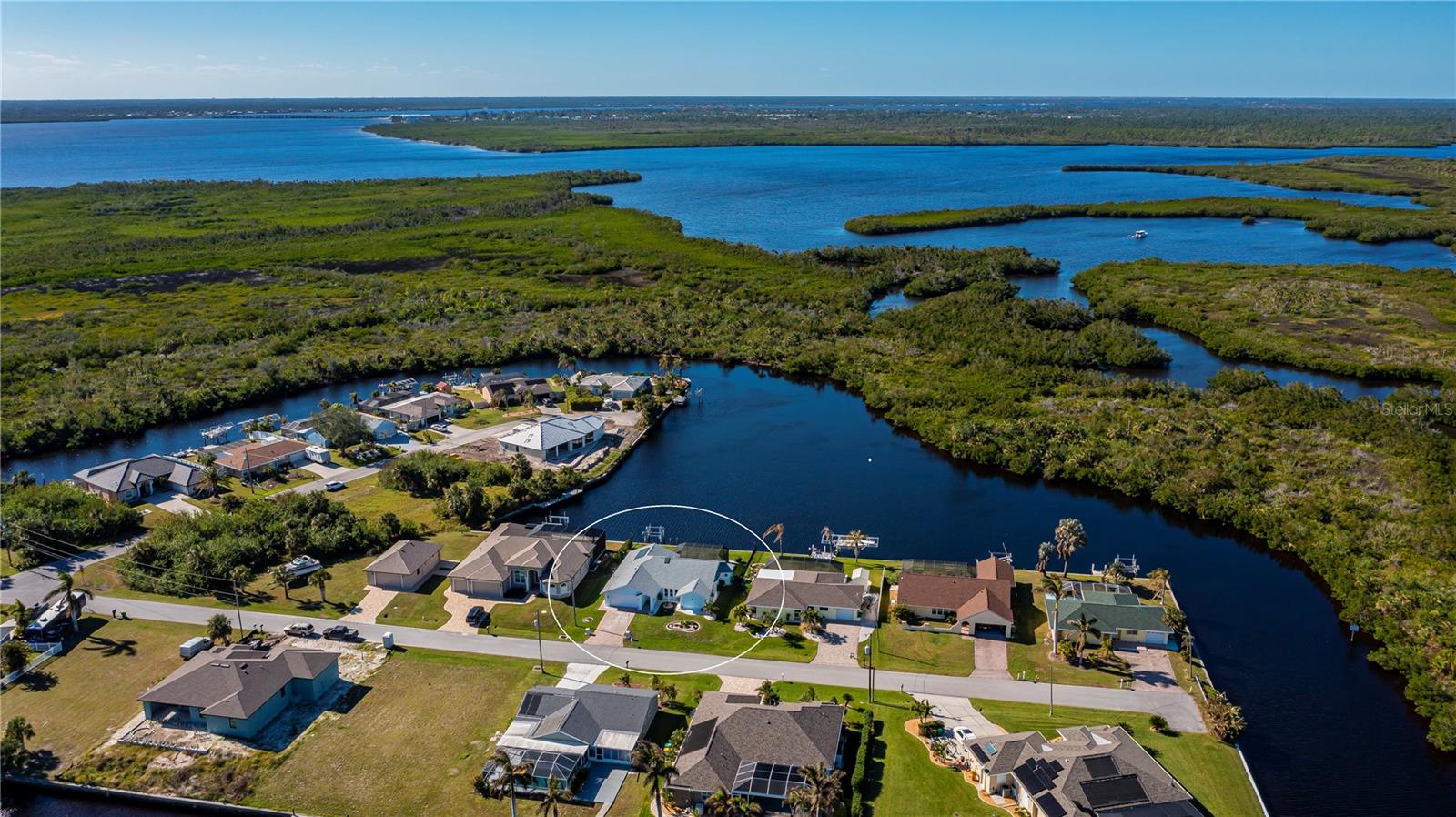 STUNNNG 3-Bedroom Pool Home with DEEP SALTWATER BASIN & PREMIUM SAILBOAT ACCESS located in the Luxurious O’Hara Waterfront Community!
Discover your private paradise in the exclusive O'Hara area, renowned for its custom waterfront estates. This breathtaking 3-bedroom, 3-bathroom, 2-car garage home sits on a deep and wide saltwater basin, offering spectacular panoramic water and island views that promise picture-perfect sunsets every evening.
Step into elegance with custom stone-front pillars leading you down a rich paver driveway complemented by low-maintenance concrete curbing and secure dark metal fencing ideal for pets. This impeccably maintained residence features a brand-new roof, seperate well with irrigation, ENERGY SAVING SOLAR PANELS, custom barn door accents and a covered entry with foyer designed to catch the perfect cross breeze.
Inside, luxury tile plank flooring flows throughout two spacious living areas, each boasting custom teak and marble electric fireplaces and entertainment centers. One living space opens seamlessly via glass sliders to a private open paver patio overlooking the pool and tranquil saltwater basin—perfect for entertaining or quiet reflection.
The chef-worthy kitchen impresses with fingerprint-resistant stainless steel appliances including a convection double oven, a generous pantry, soft-close two-tone shaker cabinetry with blurred glass accents, breakfast bar, designer backsplash, granite countertops, extra deep sink with filtration, and a convenient pass-through to the pool patio.
Relax in the master suite, a true sanctuary with private pool and patio access, exceptionally spacious walk-in closets, an inset ambient fireplace, and a spa-inspired ensuite bath featuring coastal European cabinetry, dual sinks with illuminated faucets, blue marble countertops, and an oversized glass shower with rain and handheld heads.
Two spacious guest bedrooms provide ample closet space and suspended TVs—one with a built-in office area, another with enchanting water and sunset views. They share a beautifully appointed second bath that guests will adore.
Enjoy year-round swimming in the meticulously resurfaced and HEATED POOL framed by unobstructed water vistas and lush island views with ABSOLUTE PRIVACY —no neighbors in sight. The covered patio provides shade, a modern steel sink, generous storage, PLUS a special outdoor bath with air conditioning for extra convenience.
Additional highlights: boatlift, irrigation system with dedicated pump, 2023 hurricane windows, inside laundry with extra storage, automatic dusk-to-dawn solar canal lights, new water softener, R30 ceiling insulation, R13 insulated and vapor-barrier furred walls, plus no detail overlooked in home’s premium construction.
Located in Southwest Florida’s vibrant community with easy access to boating, fishing, Gulf beaches, golfing, dining, parks, public tennis courts, shopping, Tampa Bay Rays Training Stadium, Punta Gorda Regional Airport, Fisherman’s Village, and the Historic District.
This exceptional waterfront home offers the ultimate blend of luxury, privacy, and lifestyle. Schedule your personal showing today to experience this remarkable property firsthand.