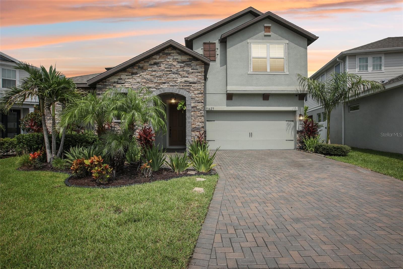 Resort-Style Living in The Reserve at Westchase
Welcome to a home that makes every day feel like a getaway. Nestled behind the gates of The Reserve at Westchase this thoughtfully upgraded 4-bedroom, 3-bathroom home offers the perfect mix of comfort, convenience, and fun. The Resort-Style saltwater heated pool and spa truly sets this fabulous home apart.
Built in 2020 and designed for modern living, the 3,161 sq. ft. layout features an open-concept floor plan centered around a chef-inspired kitchen with a 10-foot quartz island, stainless steel appliances, and custom cabinetry. The space flows effortlessly into the living area and out to the covered lanai, where a full outdoor kitchen (complete with grill, dual side burner, fridge, and 50” TV) invites laid-back evenings and weekend get-togethers perfect for entertaining. A pergola adds shade and style, and little ones will love the Gorilla playground out back.
The Pentair pool equipment makes it easy to enjoy the spa or splash on a whim, while landscape lighting and a raised garden bed with irrigation make the fully fenced yard (6’ aluminum fencing) feel like a true oasis. There’s even a Tesla car charger, and Tesla solar panels with a Tesla backup battery—backed by a 20-year warranty—for peace of mind and energy savings.
Inside, natural light fills the home thanks to custom windows, some with motorized Hunter Douglas shades in the main areas. The main floor has polished tile throughout, while the upstairs retreat offers soft carpet underfoot. The primary suite is a calming escape with a spa-like bath, upgraded custom closets that makes you feel your at a World Class Spa.The magnificent home features smart home setup that includes Lutron Caseta lighting and fan switches, Philips Hue hub, two Ecobee thermostats, Abode security system, smart garage door, Logitech doorbell with two exterior cameras, and a Rachio smart irrigation controller. This home truly has ALL of the Bells & Whisles!
Additional perks? Washer/dryer, extra fridge in the garage, custom overhead storage racks, and a whole-house water purification and softening system, plus ultrafiltration for the refrigerator dispenser.
From the stone-accented exterior and brick paver driveway to the tech-savvy features and backyard upgrades, every detail was chosen to make life a little easier—and a lot more enjoyable. All of this, just minutes from great schools, shopping, dining, and parks.
Looking for something that truly has it all? This one’s ready when you are. This home will not last, reserve your private showing today!