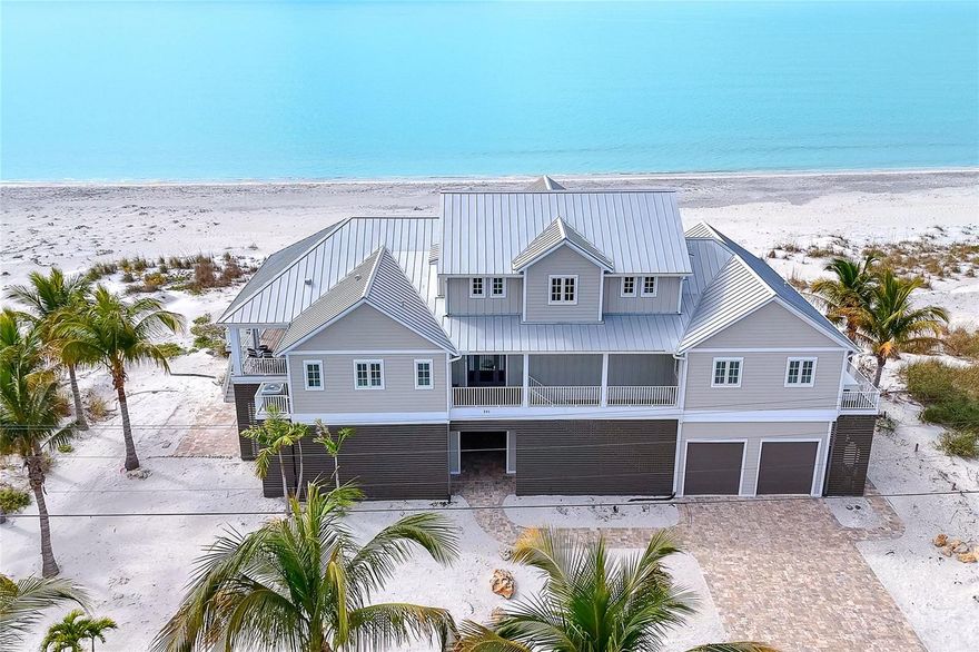 Absolutely stunning 4 bedroom, 3 and 1/2 bath home with 150 feet on the Gulf!!!  Expansive views of pristine white sand beach and turquoise waters from almost every room!  Large primary suite on the first floor, two ensuite guest bedrooms on the second level, 3 family/sitting areas, exercise room and elevator.  Electric fireplaces in the living area and primary bedroom. State of the art appliances in the expertly laid out kitchen: Wolf gas cooktop, Subzero 60" refrigerator/freezer, Bosch wall oven and microwave, Whirlpool dishwasher, wet bar with Subzero beverage fridge and LG washer and dryer.  Phantom power screens and storm shutters on lanais.  There is European White Oak flooring, granite countertops in kitchen, security system and Generac whole house generator.  Bathrooms have walk-in showers and quartz countertops.  The floor plan is open and airy with livable space galore. Outdoor kitchen on the rear deck and and a private walkover to the beach. The home is located on Don Pedro-Knight-Palm Island, a bridgeless barrier island situated between Ft. Myers/Naples to the south and Sarasota/Tampa to the north.  Enjoy island living at its finest:  collecting shells and shark's teeth, kayaking, swimming, fishing, paddleboarding and basking in glorious sunsets.  Buy your piece of island paradise with it's serene lifestyle today!!