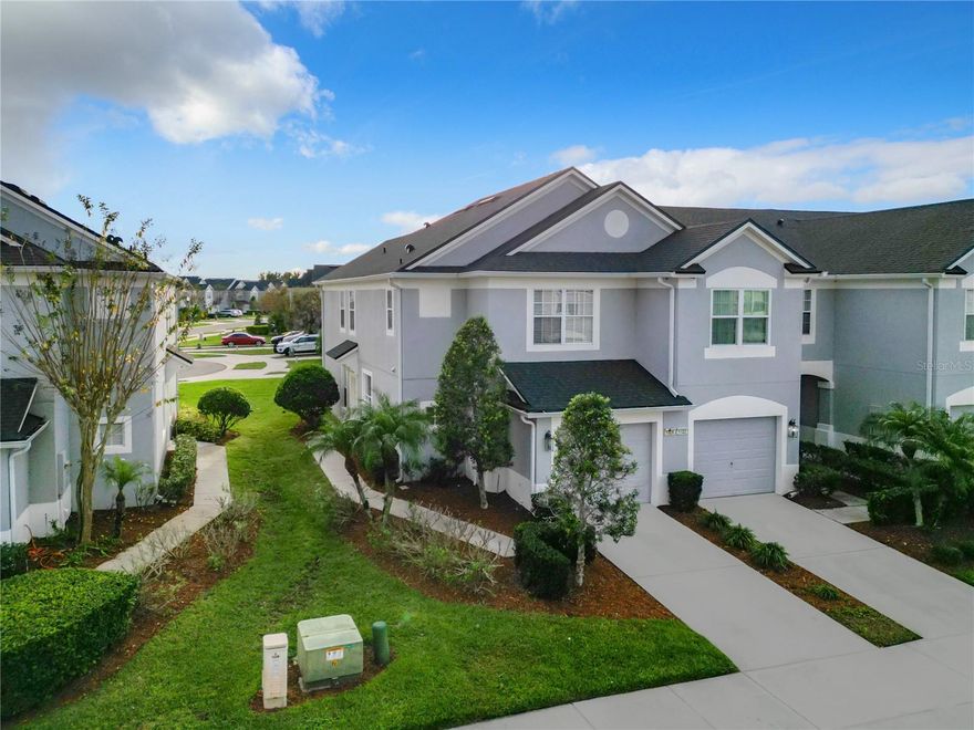 Welcome to Spring Isle’s Corner Lot Townhome, located in East Orlando’s HIGHLY-DESIRED Community in the TOP A-RATED School District!! 3 BDRM, 2.5 BATH, 1-CAR GARAGE. Townhome set on a CORNER LOT, offering more Privacy and Green Grass (that you don’t have to mow, lawn care is provided by the HOA!). At First Entry, enjoy the OPEN CONCEPT FLOOR PLAN, featuring BEAUTIFUL wood-like porcelain TILE  flooring on the main floor throughout! The Living Room boasts LARGE SLIDER DOORS that open up to a Screened-In Lanai, providing Lots of NATURAL LIGHT, and the Perfect Spot to Relax or Entertain. Conveniently, there is a Half Bath located downstairs. The Kitchen Boasts New 42-inch light-color cabinets, stainless steel appliances with granite countertops, and a breakfast bar that opens up to the nook area. Upstairs features all 3 Bedrooms and 2 Full Baths. The Master Bedroom has a Walk-In Closet and an Ensuite Master Bath with HIS/HER SINKS. The Laundry Room is conveniently located on the 2nd Floor, next to the Bedrooms. Spring Isle Townhomes offer LESS MAINTENANCE for the Homeowner with HOA covering upkeep of the exteriors including the roof, which was replaced recently in 2022! The new Air conditioning system was installed this year.  Spring Isle is one of the MOST BEAUTIFULLY decorated communities during the holidays, and year round! The Community is 24-hour guard-gated, close to all the BEST SCHOOLS, and offers TOP-NOTCH Amenities including a Community POOL and playground, and fitness center, and much more. Come see it before is gone.