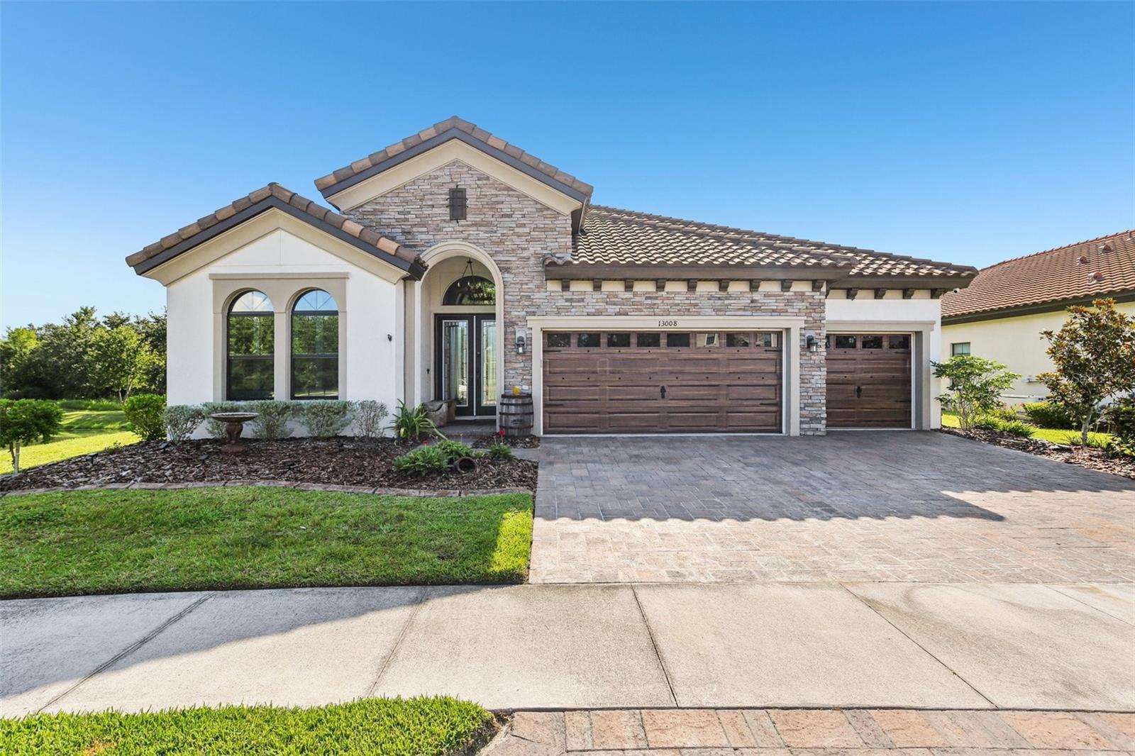 !!Assumable VA LOAN under 3% availalble!! Don't miss this unique opportunity to purchase a as new beautiful home with pondview at the end of a cul-de-sac, in the gated Hawkstone Artisan community, zoned for desirable Newsome High School and Barrington Middle School. This gorgeous Bayshore I has it all. This home features Gourmet kitchen with Quartz countertops, and luxury final wood-looking flooring. The Biscayne I is an award-winning one-story floor plan that provides comfort and practicality for those who like to entertain, host family gatherings, work from home, and more! The soaring 12-foot ceilings in the foyer, formal dining room, grand room, and kitchen give way to a dramatic open plan. The luxurious downstairs owner's retreat features a double-door entry, double walk-in finished closets, a dressing area, and a generous bath with an oversized shower. This home further includes spacious secondary bedrooms and oversized laundry room, and spacious outdoor living with a covered extended lanai and upgraded landscaping. Residents enjoy the best of both worlds with resort-style amenities while staying close to top-rated Lithia schools, nature preserves, family-friendly activities, US-301, and I-75. Enjoy the pet-friendly hiking trails at the 969-acre Triple Creek Nature Preserve, less than 2 miles south, or try your hand at bicycle motocross at Triple Creek BMX, 1 mile south of Hawkstone.