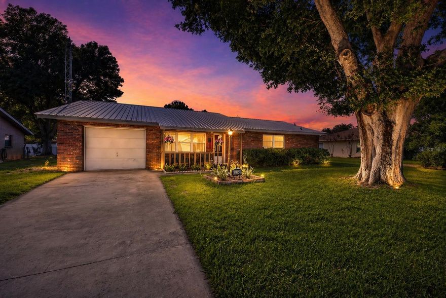 Don't wait to come see this move in ready home! Financing options include USDA/VA/FHA and down payment assistance is available, plus there is no HOA or CDD! Possible rate buy down with use of preferred lender.
This  2-bedroom, 2-bath home with a flexible den offers solid brick construction, thoughtfully updated interiors, and outdoor spaces designed for real Florida living.  It has been carefully updated to reflect modern comfort while preserving its original character. 
Imagine mornings beginning on the covered front porch—coffee in hand. 
 As you step inside, the interiors unfold with intention—warm wood flooring leads thru a  light-filled
living space that opens from the living room into a reimagined kitchen  with an eat-in area , where clean-lined white cabinetry, stainless steel appliances, and a refined hex tile backsplash create a space that feels both functional and refined.

The dining area is anchored by an original brick fireplace, complemented by a reclaimed wood chandelier. Off the dining room the enclosed sunroom creates flexibility—whether you need a quiet retreat, a guest space, a playroom, an office or somewhere to unwind at the end of the day.

Outdoors, the property transitions seamlessly into a fully fenced backyard designed for both relaxation and entertaining. A curated mix of patio, deck, pergola, and fire pit creates layered outdoor living, with ample space to further enhance—whether with a pool, garden, or additional storage for recreational assets.

Recent improvements, including a 2023 metal roof, updated electrical panel, fresh interior finishes, and full kitchen and bath renovations completed in 2025. This is a home that’s already been taken care of—so you can focus on enjoying it.