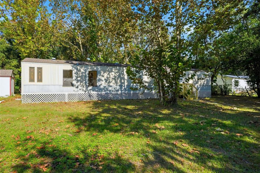 BACK ON THE MARKET. NO FAULT OF THE PROPERTY. Covington Subdivision, Corner lot, 2-Bedroom, 2-Bathroom with 924 sq ft. Creek runs the back of the property. Great opportunity to own .45 acres/ manufactured home in Land O' Lakes for under 200k. 10/2025 VAPOR BARRIER REPLACE. Property REPLUMBED. NEW FRONT AND BACK STAIRS/DECK. NEW HOT WATER HEATER. ALL OUTLETS AND SWITCHES HAVE BEEN REPLACED. Shed conveys. Water Softener. Needs some cosmetic updating. Close proximity to 41, Suncoast, shopping, dining, and medical. NO HOA. NO CDD. Listed at recent FHA appraised value.