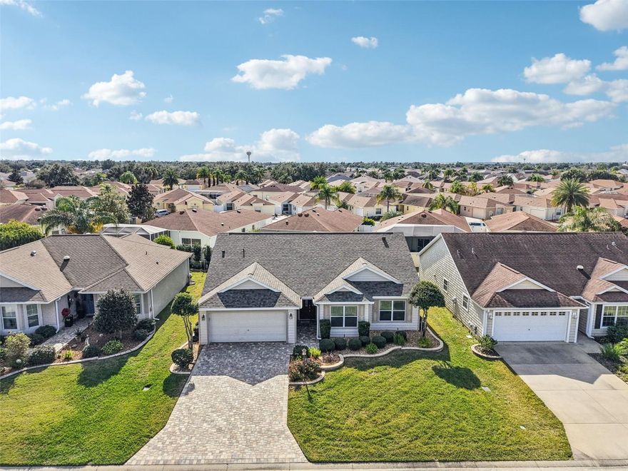 Turnkey, this beautifully maintained Whispering Pine model home sits in the highly desirable Village of St Charles. From the moment you arrive, the level of care and quality is immediately apparent. Home Features: Roof April 2025, HVAC 2019, Water Heater 2022, Eat-n-Kitchen area with Built in Buffet, Granite Countertops, Stainless Steel Appliances, a Nova whole home filtration system, a beyond normal HVAC Trane system designed to comfort those with breathing issues. There are return filters in each room, a return exhaust in garage, and system is called a Super V. You want air quality? This one satisfies even the most concerned. There is a reverse osmosis water system in kitchen, No Popcorn, a walk-in Roman Tile Shower, extra insulation in the entire home, Corian Countertops in both bathrooms, all bedrooms have new and above average carpet, a Paver Driveway, textured floor in/on Lanai, a Privacy Wall in back, and Stacked Stone all around the home. If that is not enough being Turnkey with above average furniture, there is a 2016 Club Car Electric Golf Cart rebuilt in 2020 to compliment the move-in ready home. This home is just a short golf cart ride to Sumter Landing, Lake Miona Recreation Center, and perfectly situated between all the commercial needs at CR 466 or CR 466A and Buena Vista. So many Rec Centers, Adult Pools, Pickleball, Tennis, Softball, and all the amenities provided by being a Villager. All possible conveniences such as Publix, Walgreens, CVS, Walmart, Fresh Market, Starbucks, ALDI, Costco, Hobby Lobby, restaurants, banks, LOWE'S, Home Depot, Target, and shopping are all close by. Whether you are nearby or viewing from afar, schedule a private or virtual showing and experience just how exceptional this home truly is.